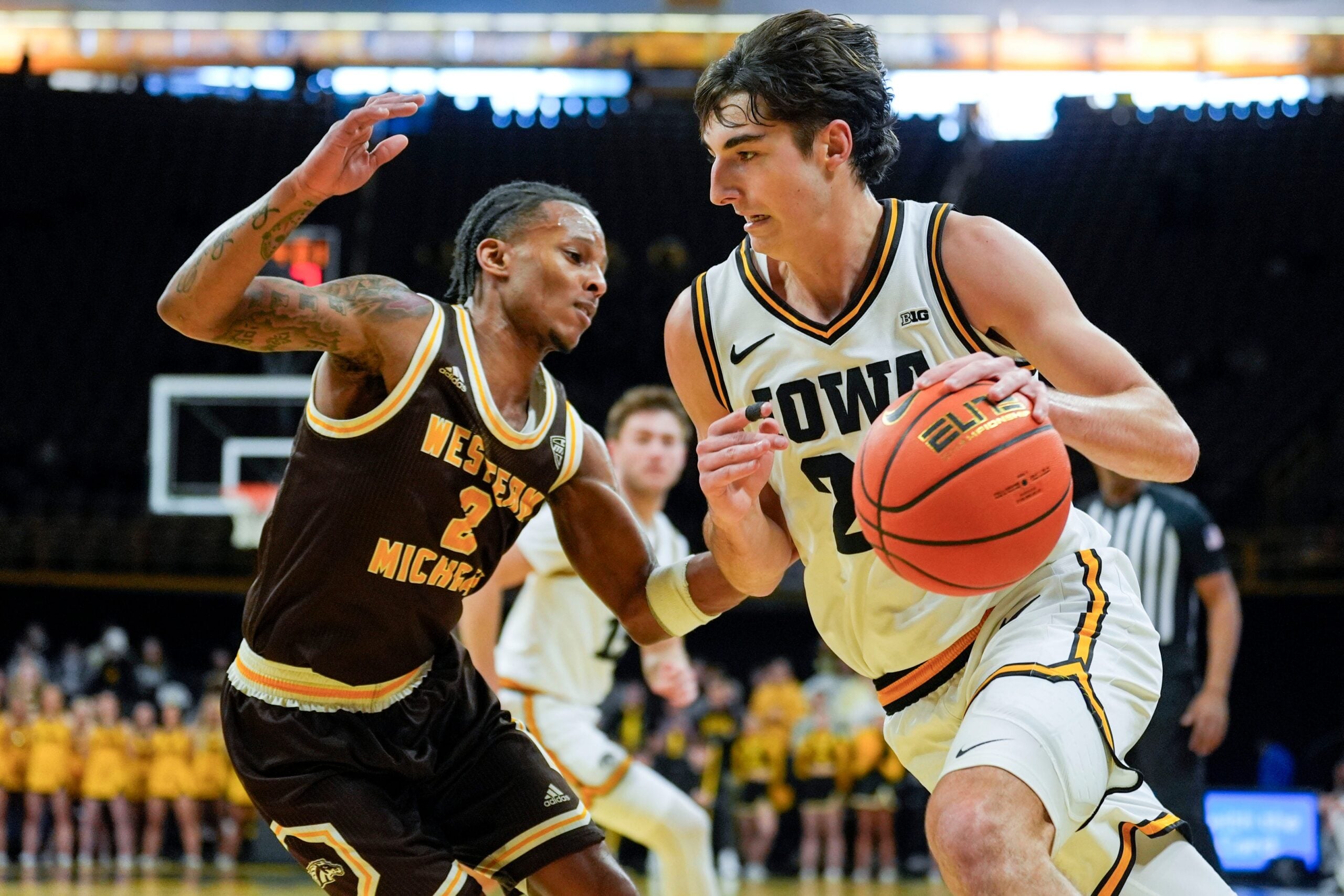 Iowa guard Tate Sage (24) drives toward the basket against Western Michigan guard Jalen Griffith (2) Dec. 14, 2025 at Carver-Hawkeye Arena in Iowa City, Iowa.