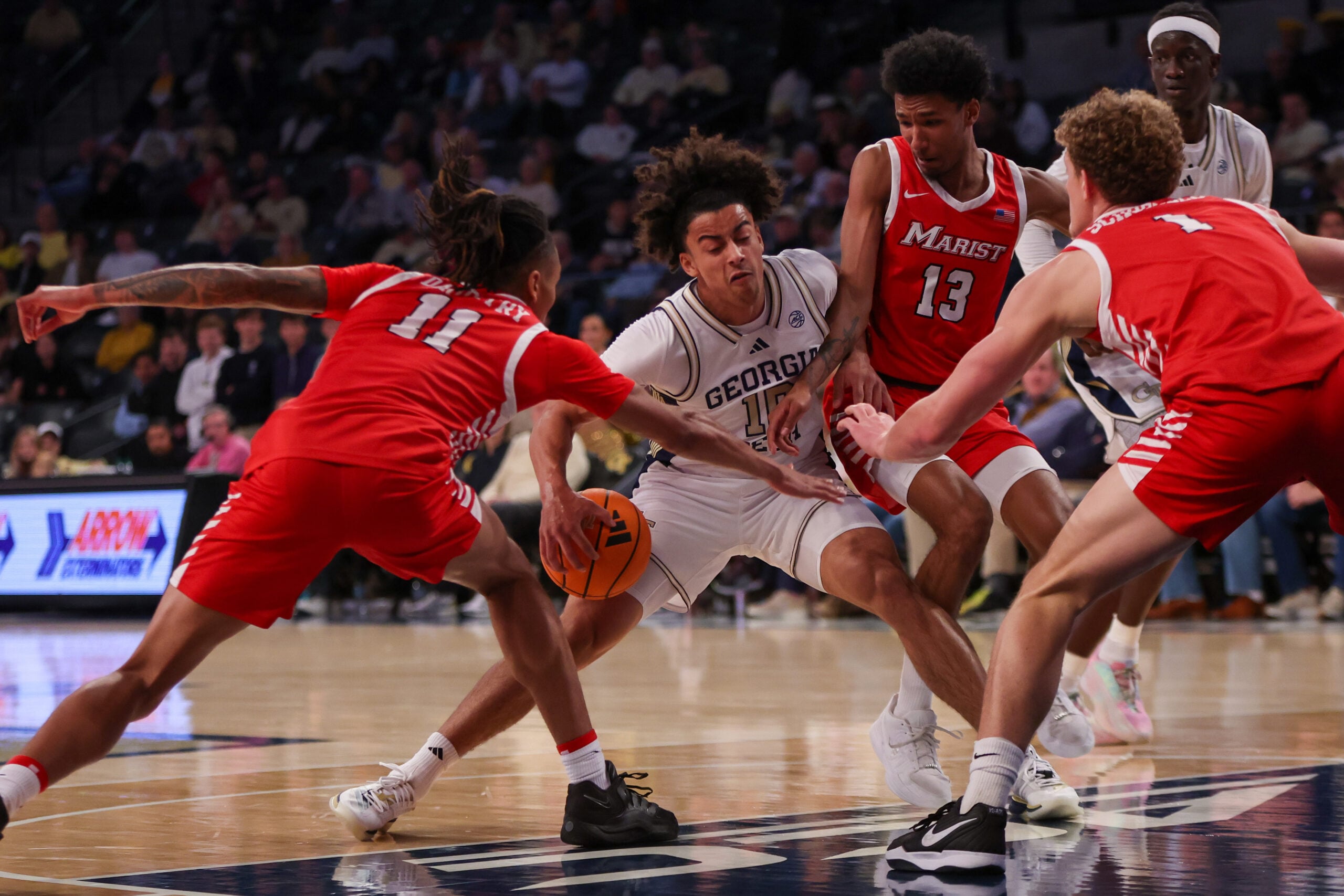 Dec 16, 2025; Atlanta, Georgia, USA; Georgia Tech Yellow Jackets guard Davi Remagen (10) is defended by Marist Red Foxes forward Jaden Daughtry (11) and guard Elijah Lewis (13) and center Jason Schofield (1) in the first half at McCamish Pavilion. Mandatory Credit: Brett Davis-Imagn Images