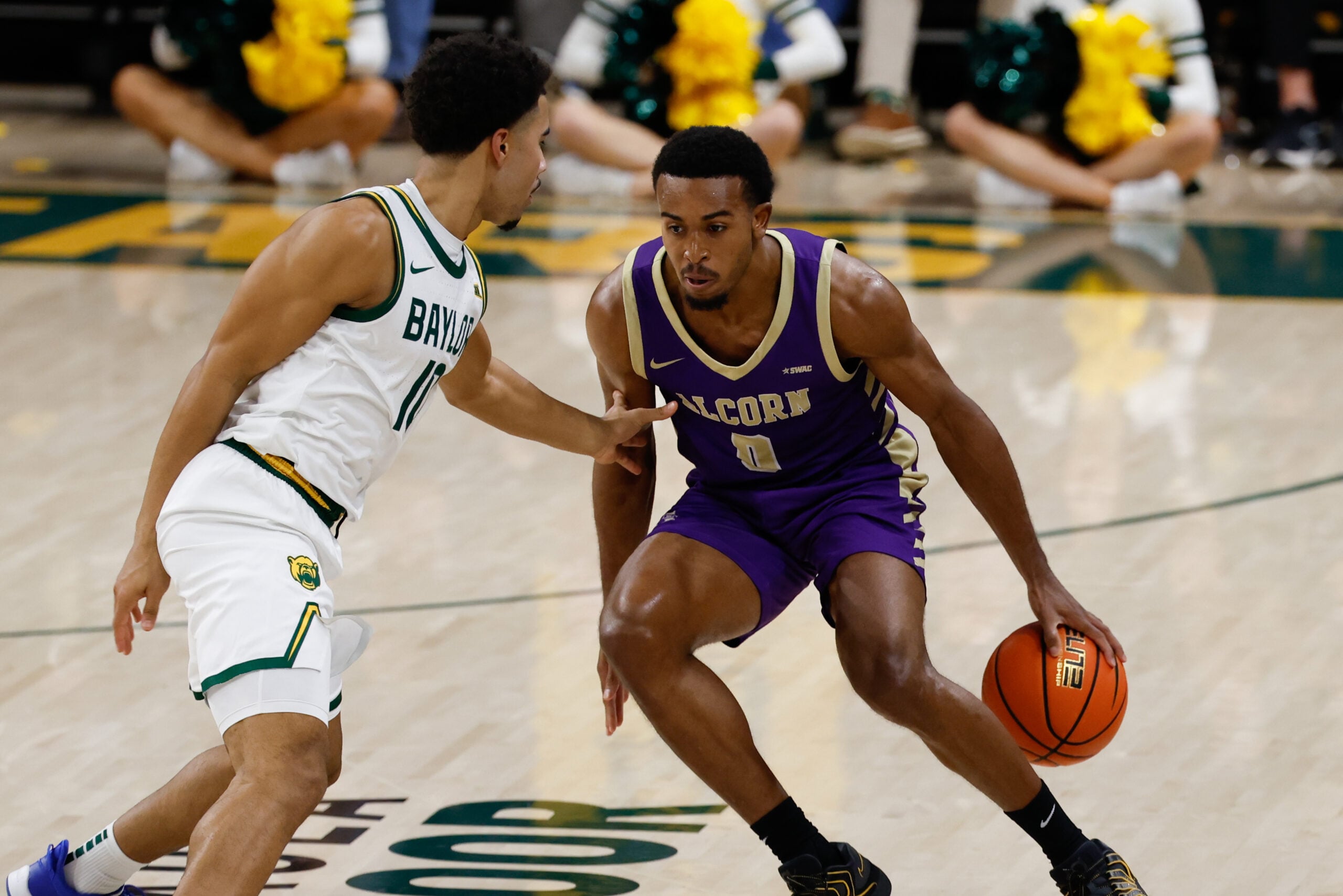 Dec 19, 2025; Waco, Texas, USA;  Alcorn State Braves guard Shane Lancaster (0) controls the ball against Baylor Bears guard Isaac Williams (10) during the first half at Paul and Alejandra Foster Pavilion. Mandatory Credit: Chris Jones-Imagn Images