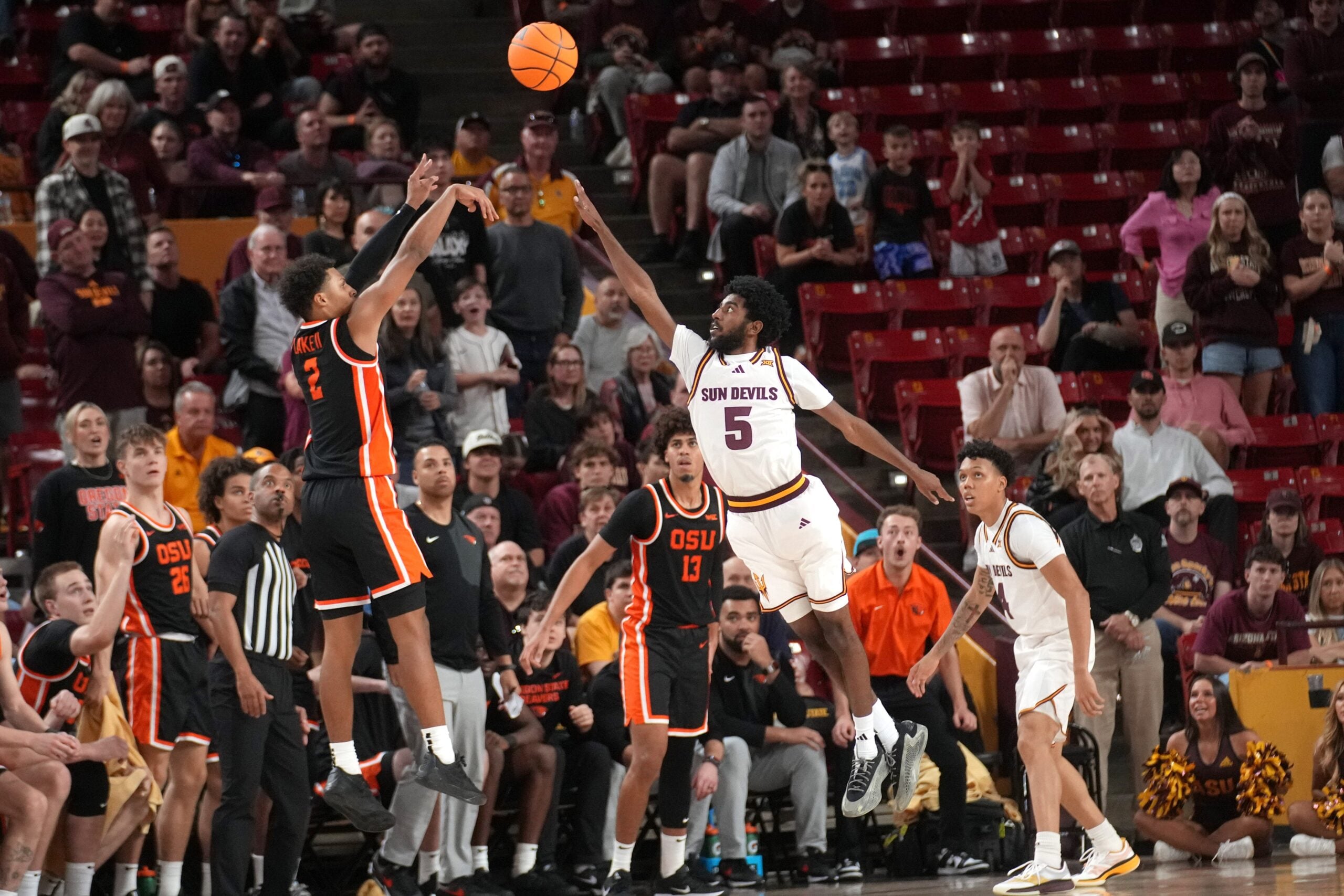 ASU Sun Devils guard Moe Odum (5) defends a shot by Oregon State Beavers guard Josiah Lake II (2) at Desert Financial Arena in Tempe on Dec. 21, 2025.