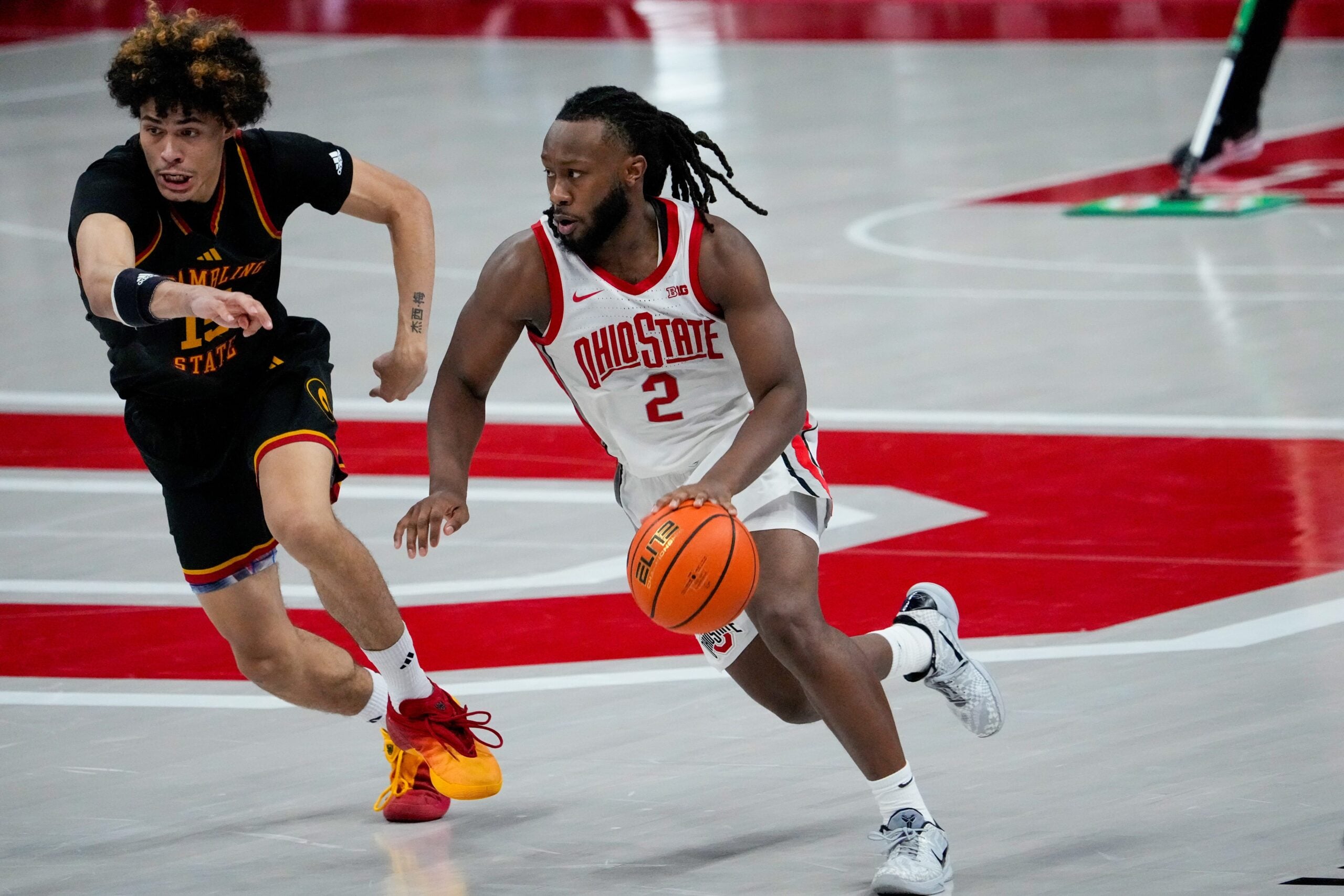 Ohio State Buckeyes guard Bruce Thornton (2) dribbles the ball against Grambling State Tigers forward Antonio Munoz (15) in the second half of the NCAA men’s basketball game Value City Arena on Tuesday, Dec. 23, 2025 in Columbus, Ohio.