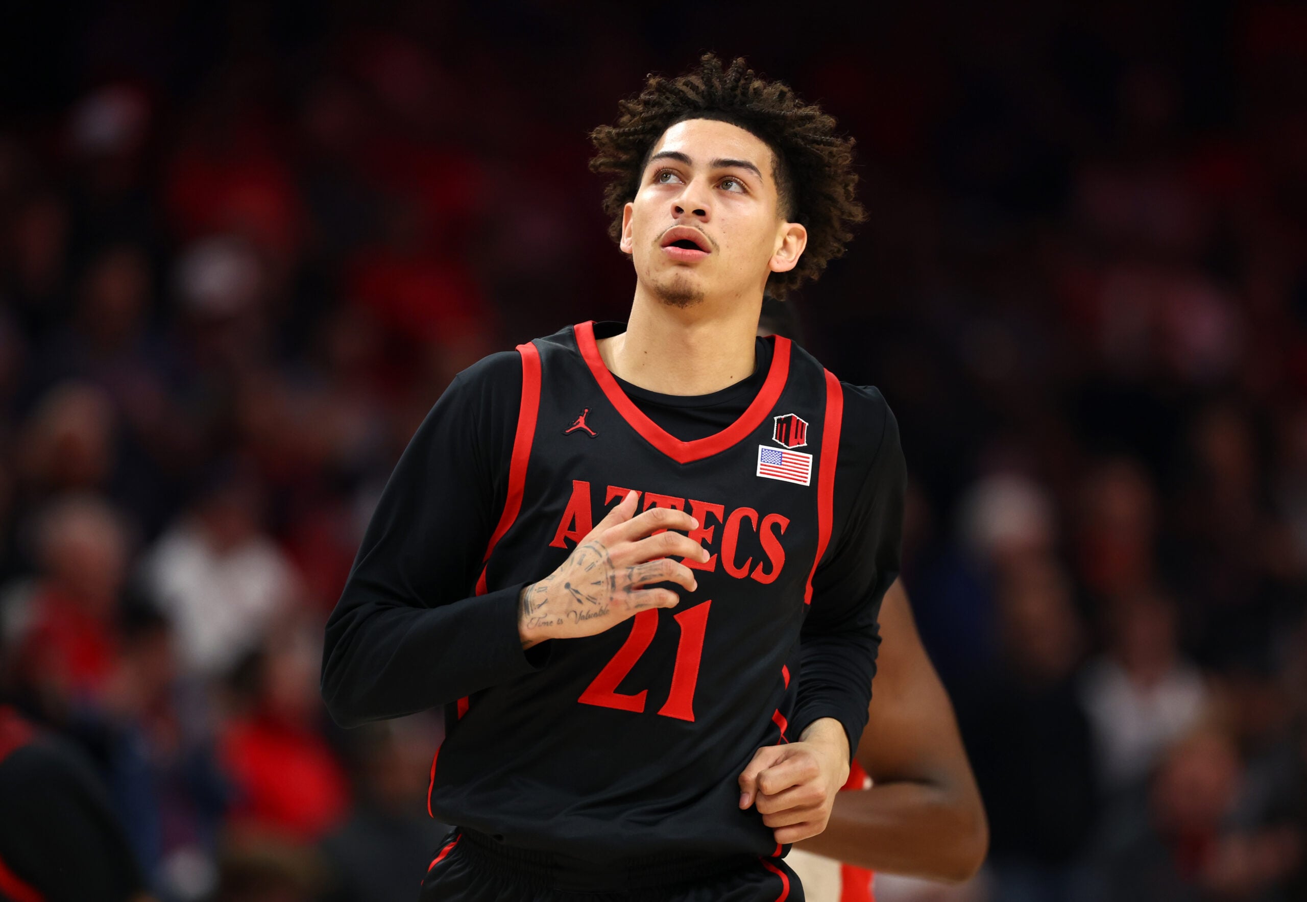 Dec 20, 2025; Phoenix, Arizona, USA; San Diego State Aztecs guard Miles Byrd (21) against the Arizona Wildcats during the Hall of Fame Series at Mortgage Matchup Center. Mandatory Credit: Mark J. Rebilas-Imagn Images