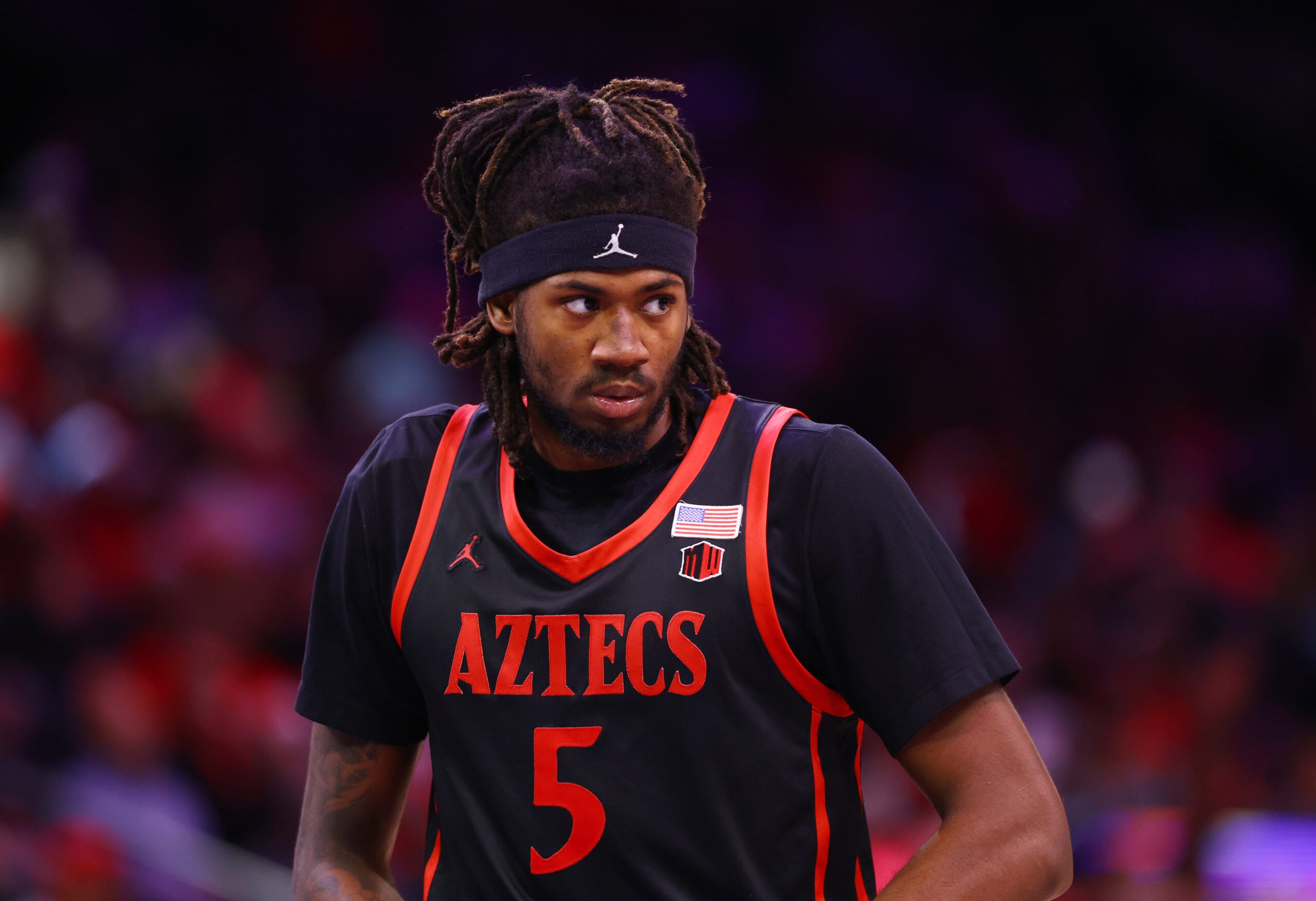 Dec 20, 2025; Phoenix, Arizona, USA; San Diego State Aztecs forward Pharaoh Compton (5) against the Arizona Wildcats during the Hall of Fame Series at Mortgage Matchup Center. Mandatory Credit: Mark J. Rebilas-Imagn Images