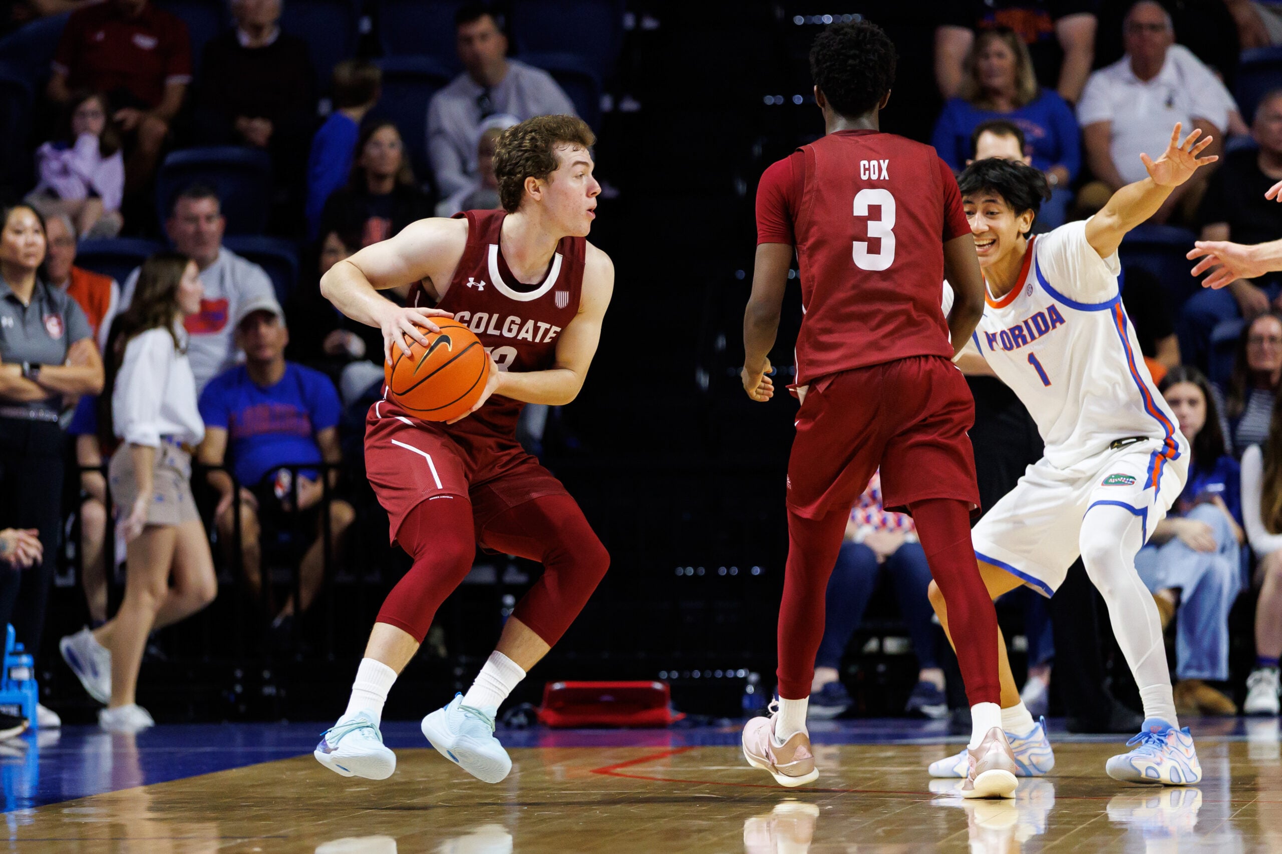 Dec 21, 2025; Gainesville, Florida, USA; Colgate Raiders guard Kyle Carlesimo (13) looks to pass while Colgate Raiders guard Jalen Cox (3) screens Florida Gators guard Xaivian Lee (1) during the second half at Exactech Arena at the Stephen C. O'Connell Center. Mandatory Credit: Matt Pendleton-Imagn Images