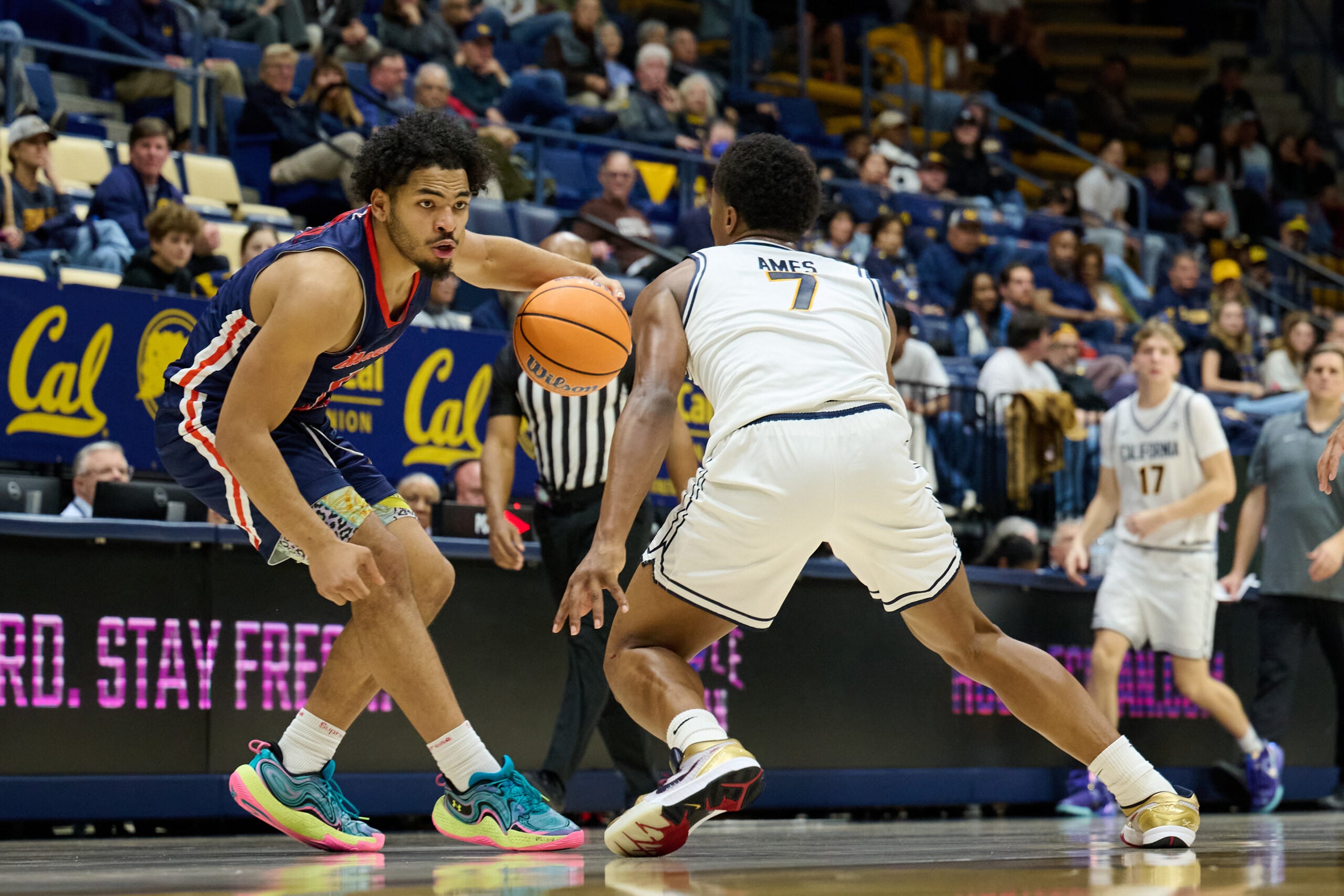 Dec 19, 2025; Berkeley, California, USA; Morgan State Bears guard Alfred Worrell Jr. (1) dribbles the ball against California Golden Bears guard Dai Dai Ames (7) during the second half at Haas Pavilion. Mandatory Credit: Robert Edwards-Imagn Images