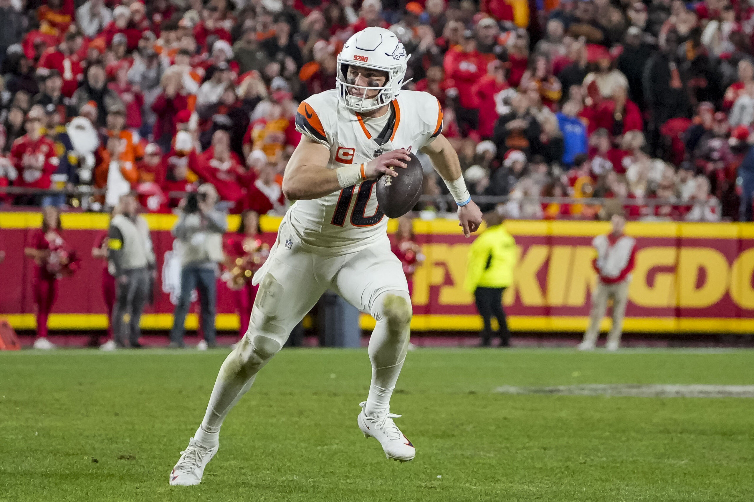 Dec 25, 2025; Kansas City, Missouri, USA; Denver Broncos quarterback Bo Nix (10) runs the ball during the fourth quarter at GEHA Field at Arrowhead Stadium. Mandatory Credit: Denny Medley-Imagn Images