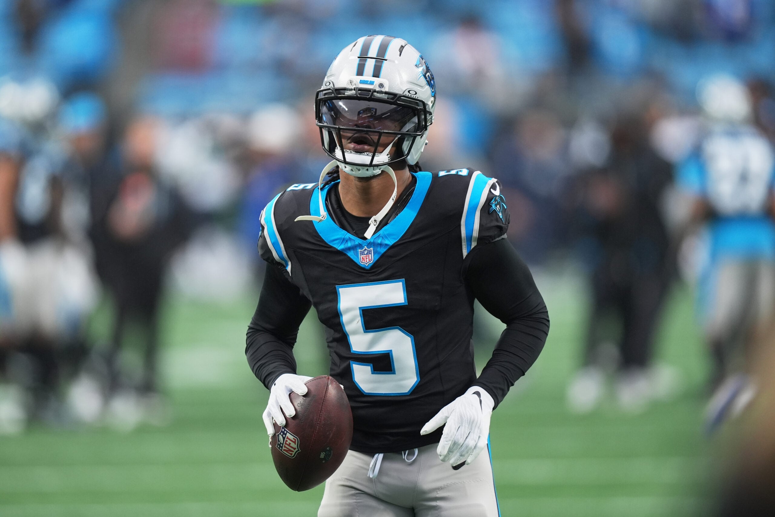 Dec 28, 2025; Charlotte, North Carolina, USA; Carolina Panthers running back Rico Dowdle (5) warms up before the game against the Seattle Seahawks at Bank of America Stadium. Mandatory Credit: Jim Dedmon-Imagn Images