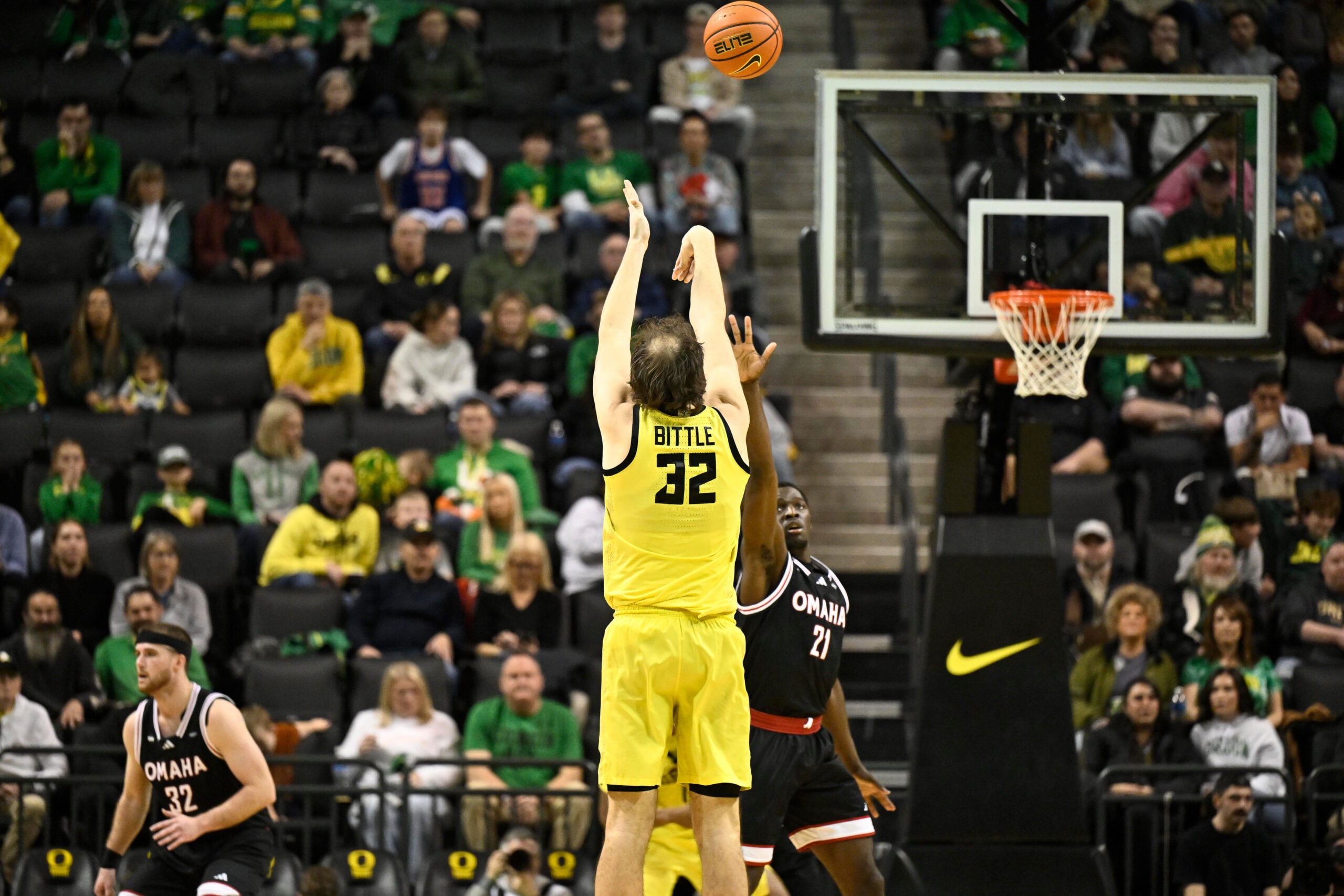 Dec 28, 2025; Eugene, Oregon, USA;  Oregon Ducks center Nate Bittle (32) shoots the ball over Omaha Mavericks forward Valentino Simon (21) during the second half at Matthew Knight Arena. Mandatory Credit: Craig Strobeck-Imagn Images