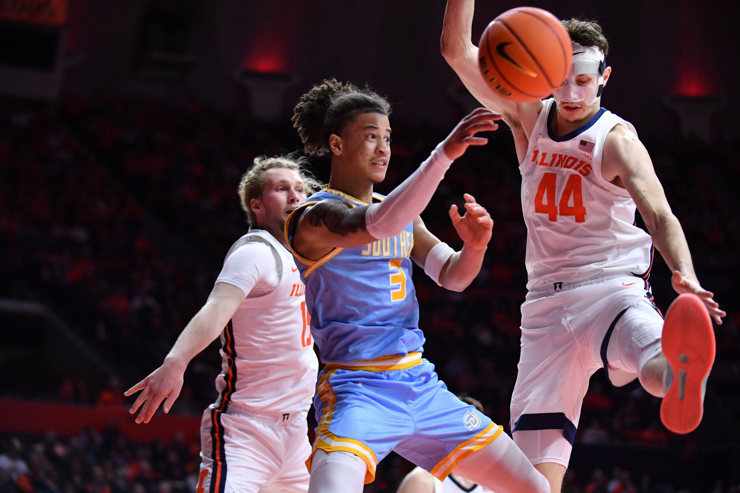 Dec 29, 2025; Champaign, Illinois, USA; Southern University Jaguars guard Cam Amboree (3) passes the ball by Illinois Fighting Illini forward Zvonimir Ivisic (44) during the second half at State Farm Center. Mandatory Credit: Ron Johnson-Imagn Images