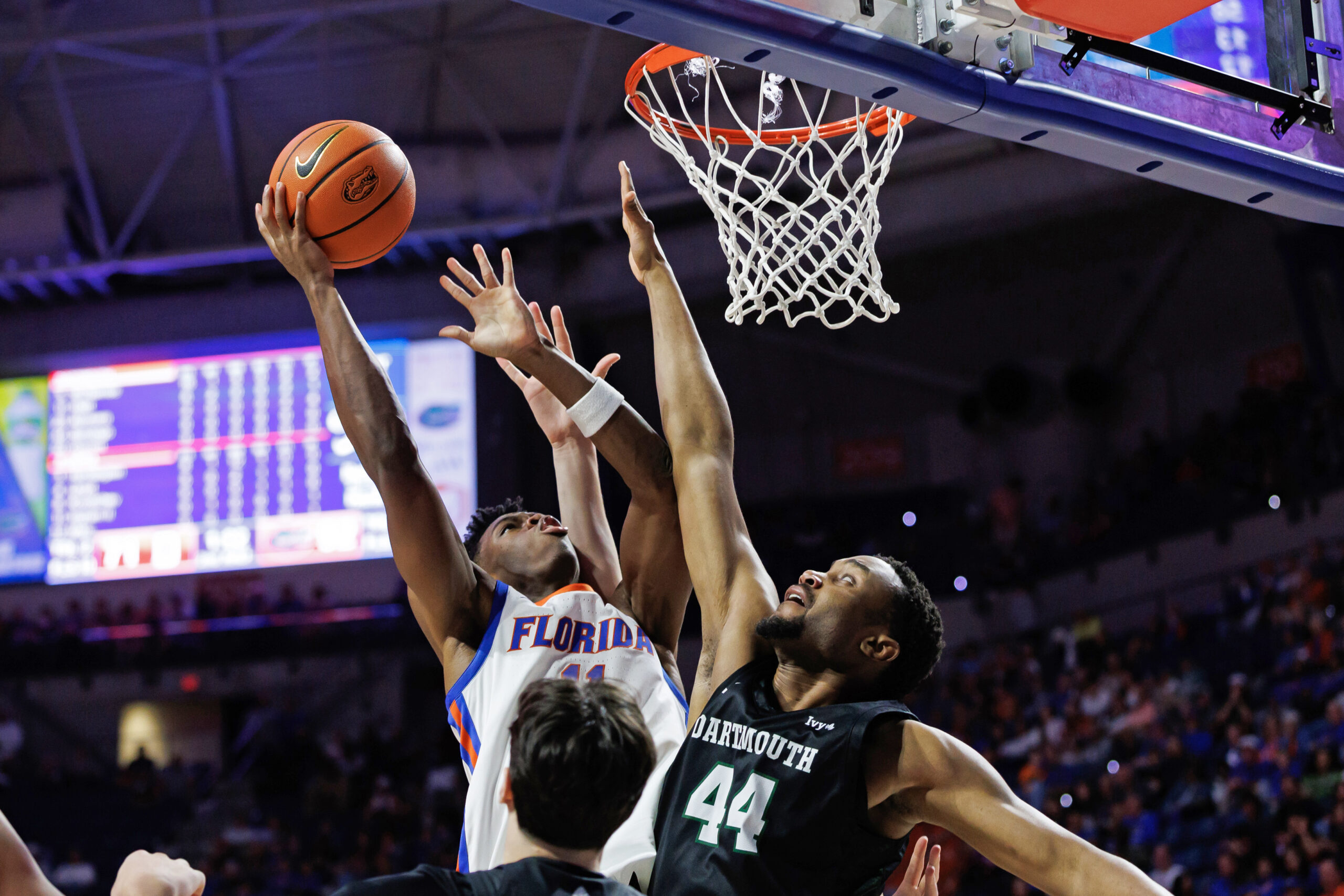 Dec 29, 2025; Gainesville, Florida, USA; Florida Gators guard CJ Ingram II (11) shoots over Dartmouth Big Green forward Shanon Simango (44) during the second half at Exactech Arena at the Stephen C. O'Connell Center. Mandatory Credit: Matt Pendleton-Imagn Images