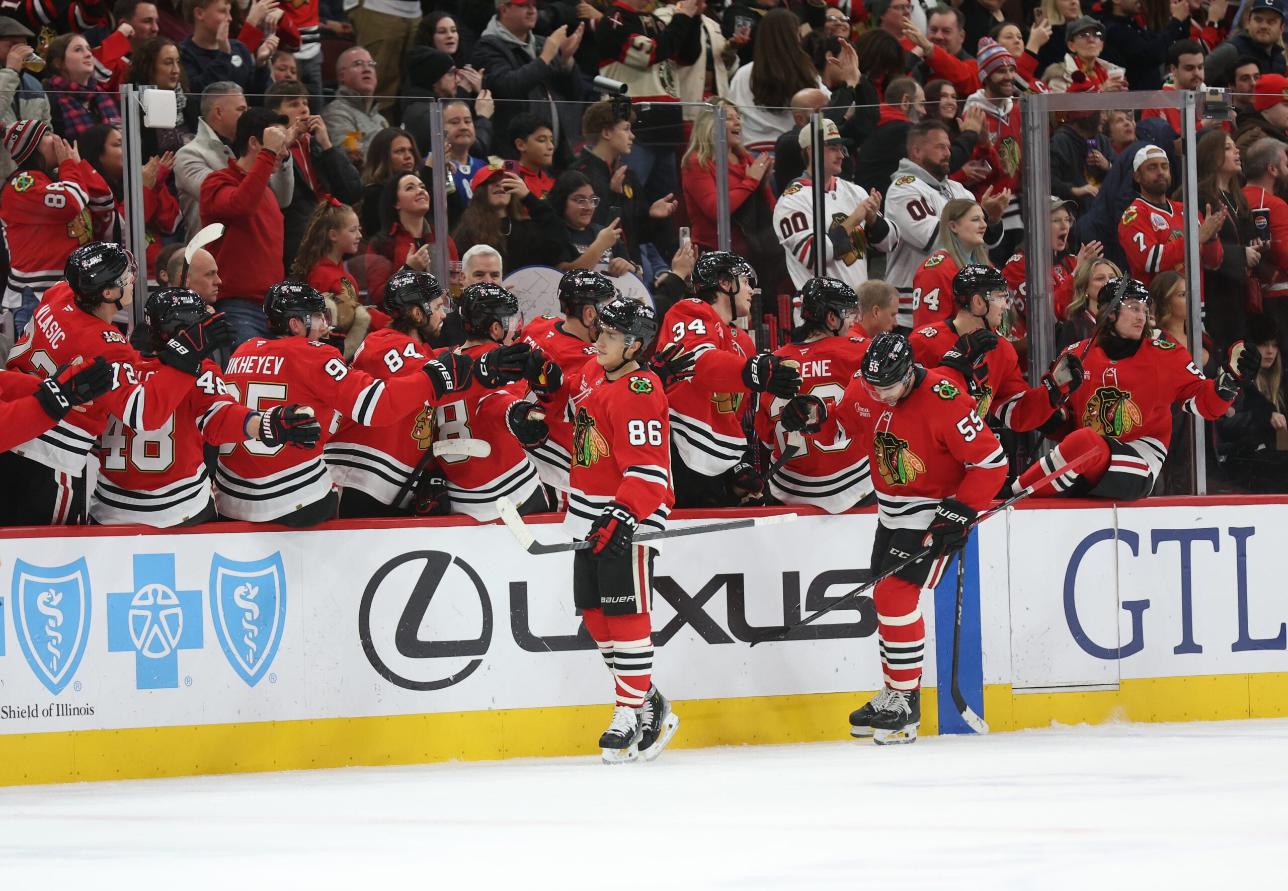 Dec 30, 2025; Chicago, Illinois, USA; Chicago Blackhawks center Teuvo Teravainen (86) high-fives teammates after scoring during the second period against the New York Islanders at United Center. Mandatory Credit: Talia Sprague-Imagn Images