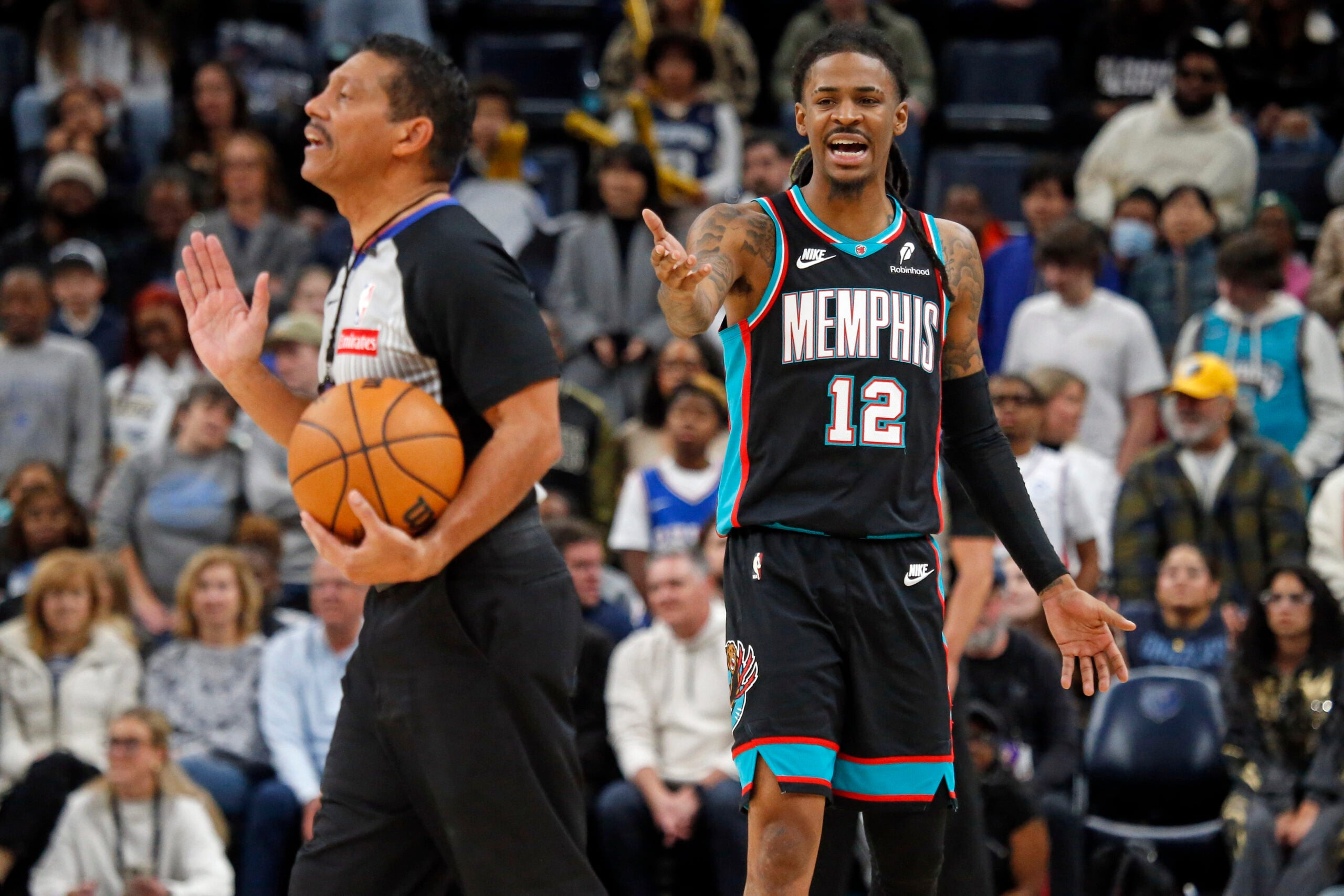 Dec 30, 2025; Memphis, Tennessee, USA; Memphis Grizzlies guard Ja Morant (12) reacts toward an official during the fourth quarter against the Philadelphia 76ers at FedExForum. Mandatory Credit: Petre Thomas-Imagn Images