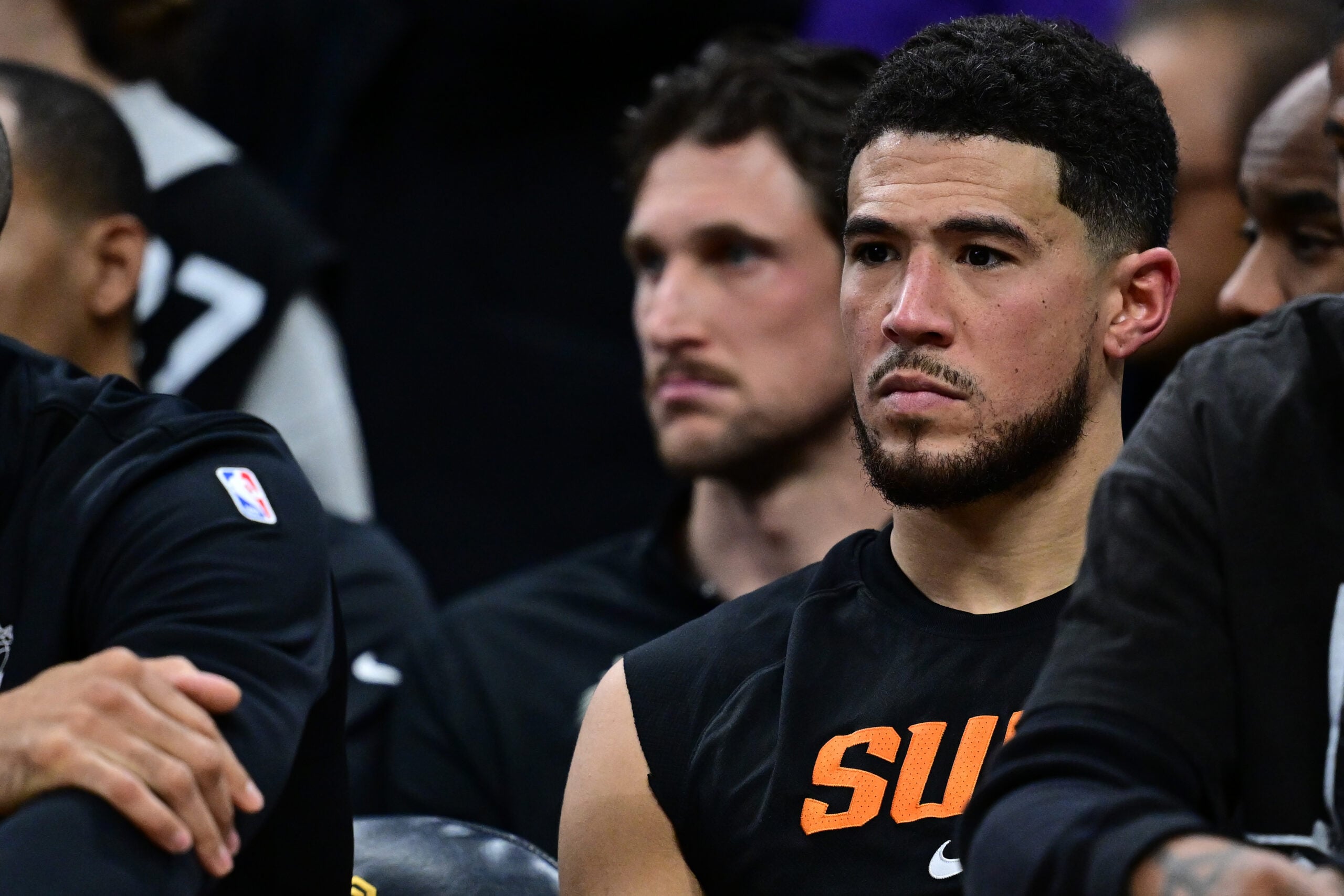 Dec 31, 2025; Cleveland, Ohio, USA; Phoenix Suns guard Devin Booker (1) sits on the bench during the second half against the Cleveland Cavaliers at Rocket Arena. Mandatory Credit: David Dermer-Imagn Images