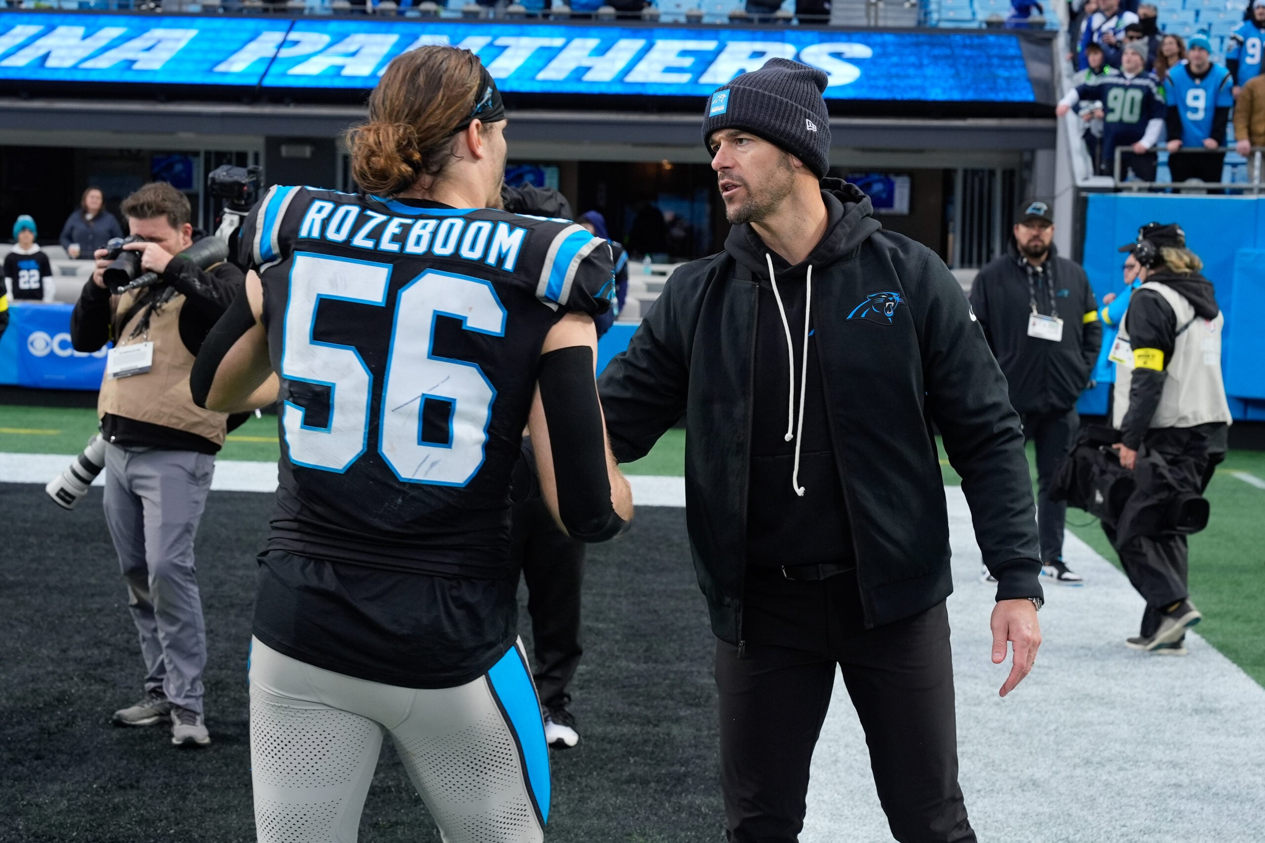 Dec 28, 2025; Charlotte, North Carolina, USA; Carolina Panthers head coach Dave Canales thanks linebacker Christian Rozeboom (56) during the second half at Bank of America Stadium. Mandatory Credit: Jim Dedmon-Imagn Images