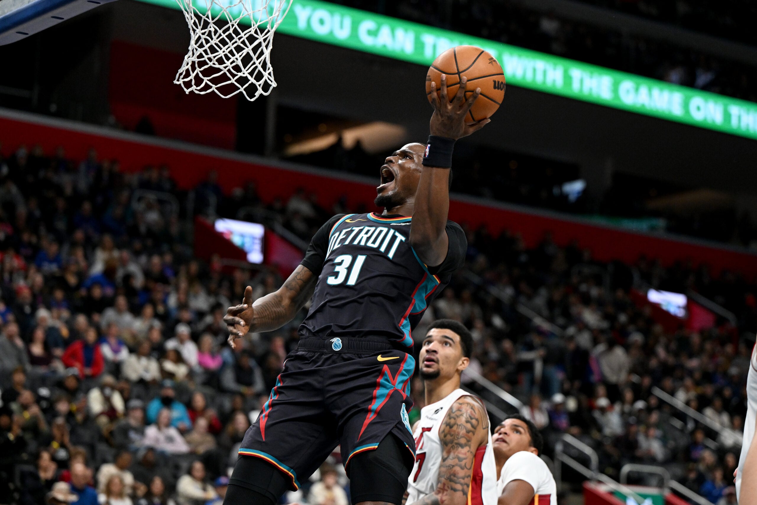 Jan 1, 2026; Detroit, Michigan, USA; Detroit Pistons guard Javonte Green (31) shoots the ball against the Miami Heat in the second quarter at Little Caesars Arena. Mandatory Credit: Lon Horwedel-Imagn Images