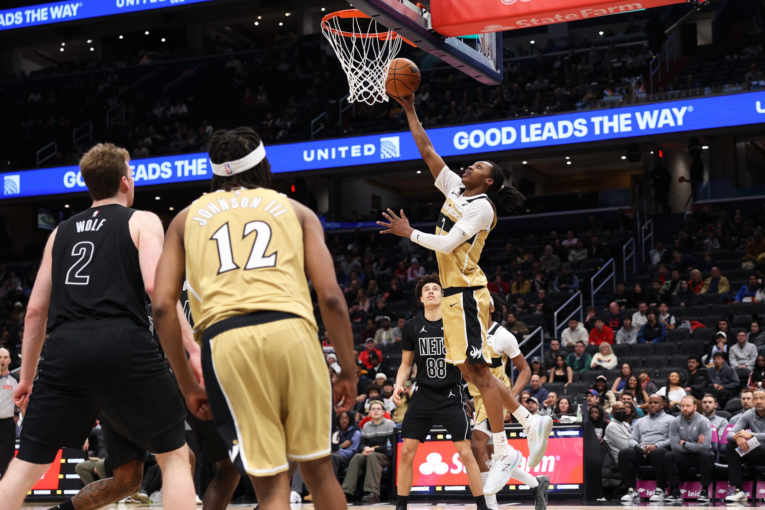 Jan 2, 2026; Washington, District of Columbia, USA; Washington Wizards guard Bub Carrington (7) takes a shot over Brooklyn Nets guard Nolan Traore (88) during the second half at Capital One Arena. Mandatory Credit: Daniel Kucin Jr.-Imagn Images