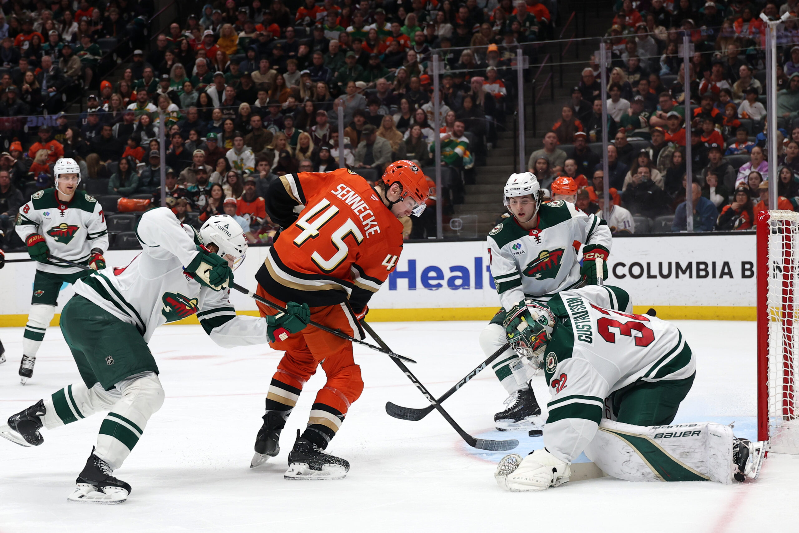 Jan 2, 2026; Anaheim, California, USA;  Anaheim Ducks right wing Beckett Sennecke (45) shoots the puck against Minnesota Wild goaltender Filip Gustavsson (32) during the second period at Honda Center. Mandatory Credit: Kiyoshi Mio-Imagn Images