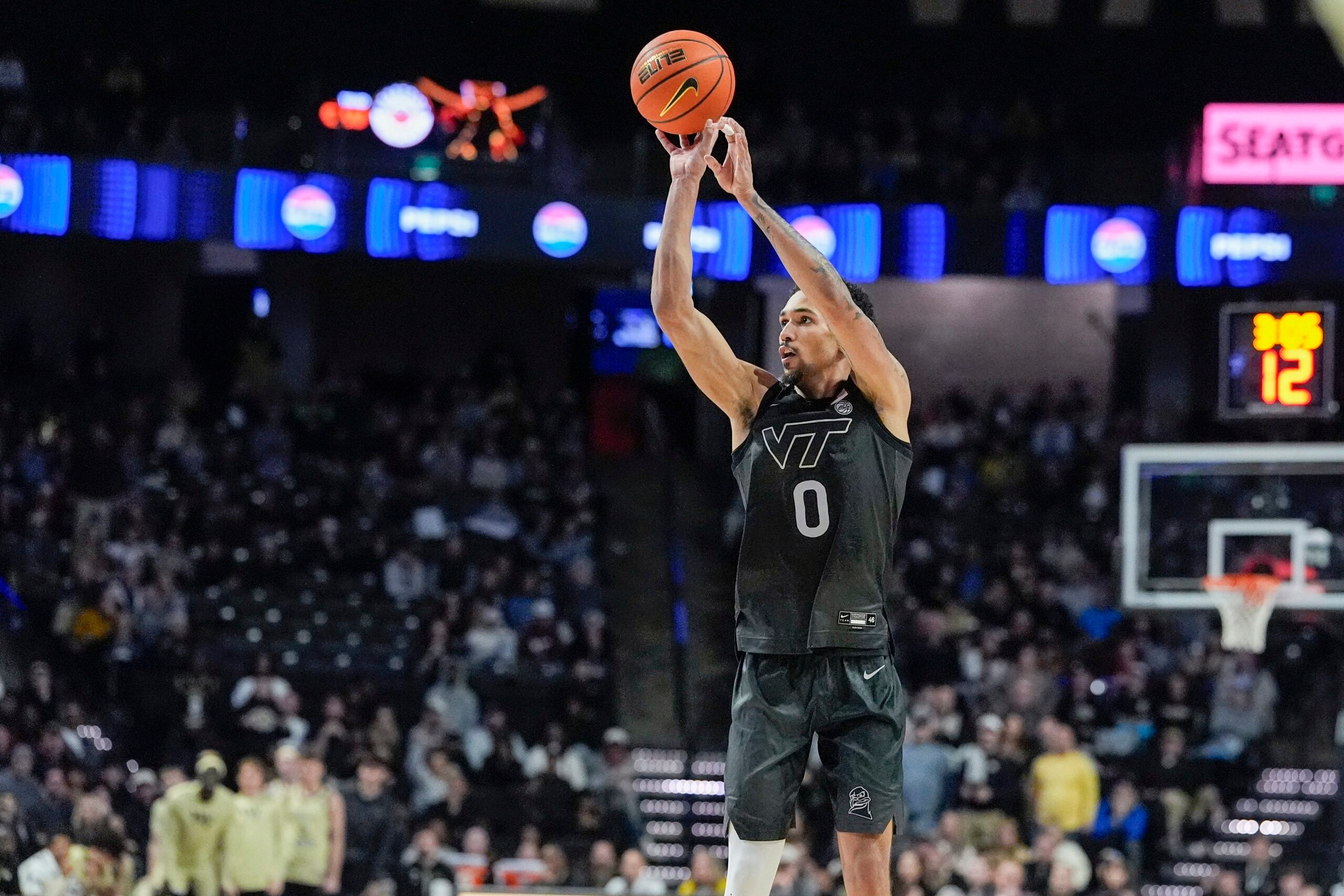 Jan 3, 2026; Winston-Salem, North Carolina, USA; Virginia Tech Hokies guard Jailen Bedford (0) shoots the ball against the Wake Forest Demon Deacons during the second half at Lawrence Joel Veterans Memorial Coliseum. Mandatory Credit: Jim Dedmon-Imagn Images