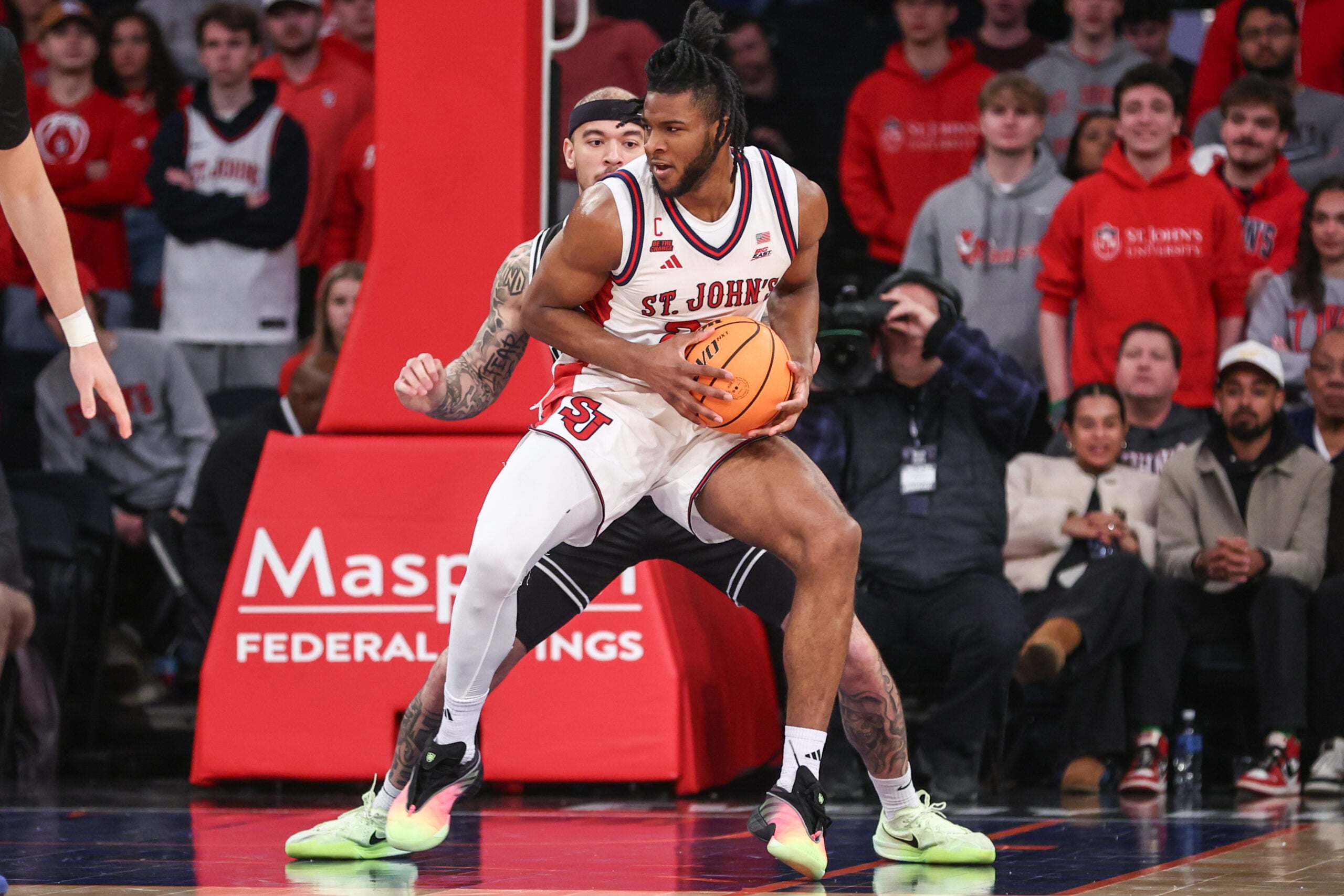 Jan 3, 2026; New York, New York, USA;  St. John's Red Storm forward Zuby Ejiofor (24) looks to post up against Providence Friars forward Duncan Powell (31) in the first half at Madison Square Garden. Mandatory Credit: Wendell Cruz-Imagn Images