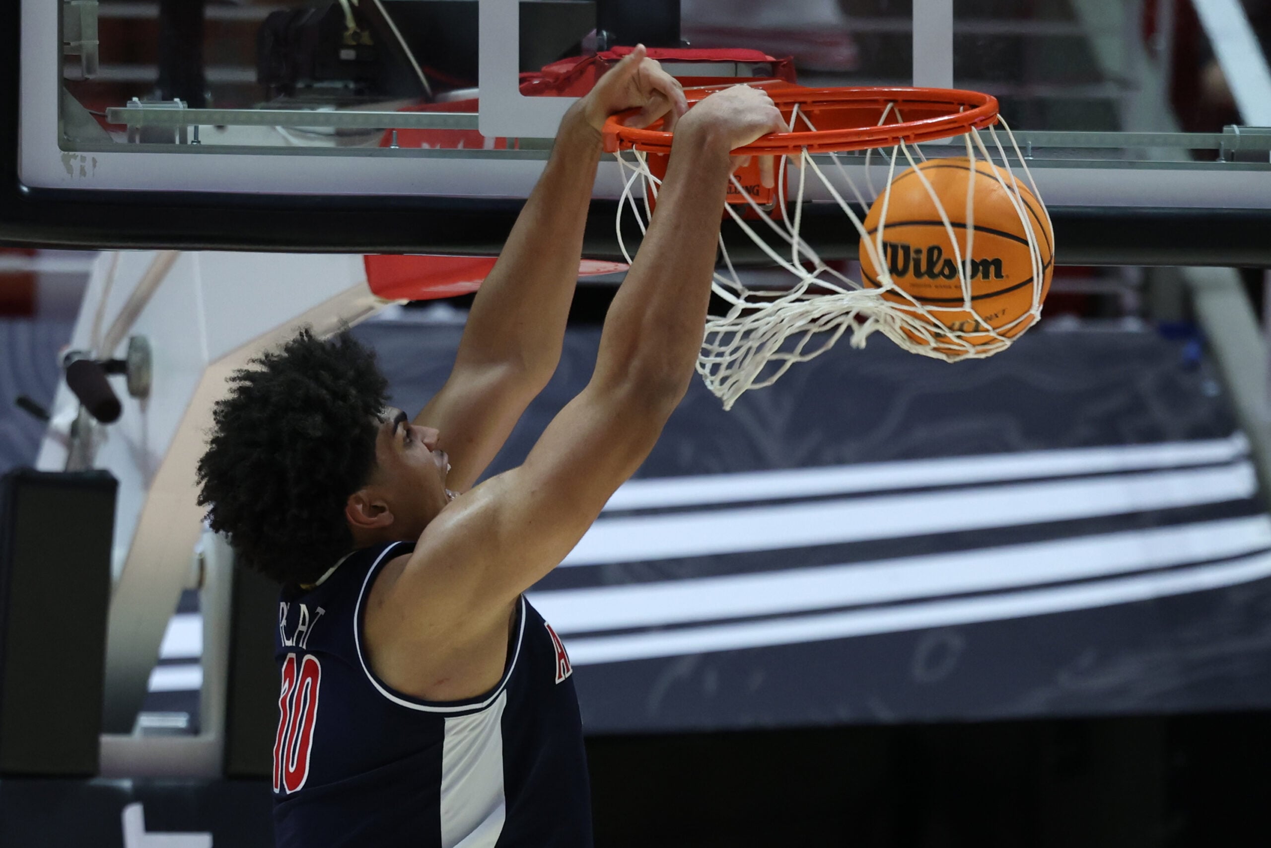 Jan 3, 2026; Salt Lake City, Utah, USA; Arizona Wildcats forward Koa Peat (10) dunks the ball against the Utah Utes during the second half at Jon M. Huntsman Center. Mandatory Credit: Rob Gray-Imagn Images