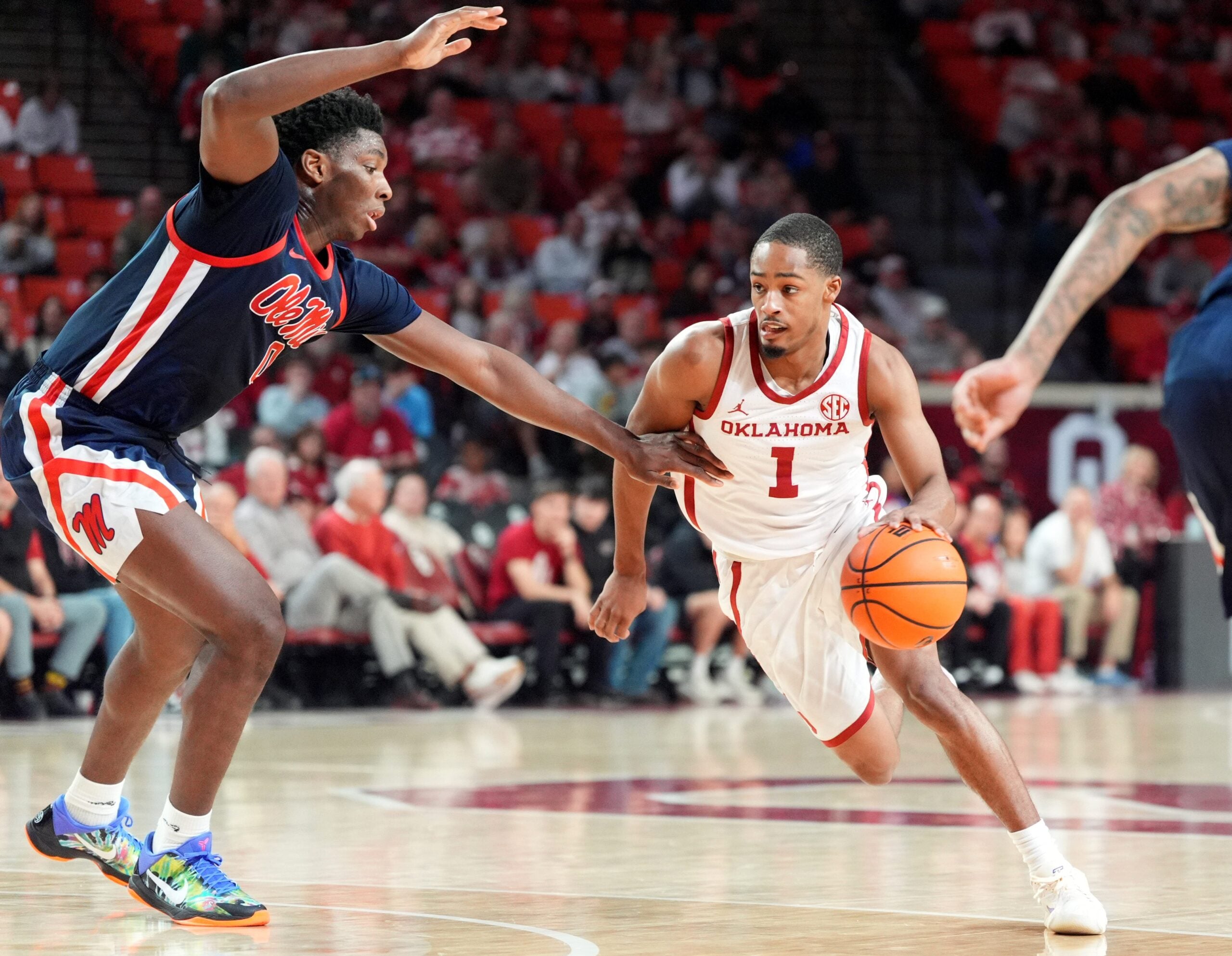 Oklahoma's Xzayvier Brown (1) drives up court as Ole Miss' Malik Dia (0) defends in the second half of the menÕs college basketball game between the University of Oklahoma Sooners and Ole Miss at Lloyd Noble Center in Norman, Okla., Saturday Jan. 3, 2026.