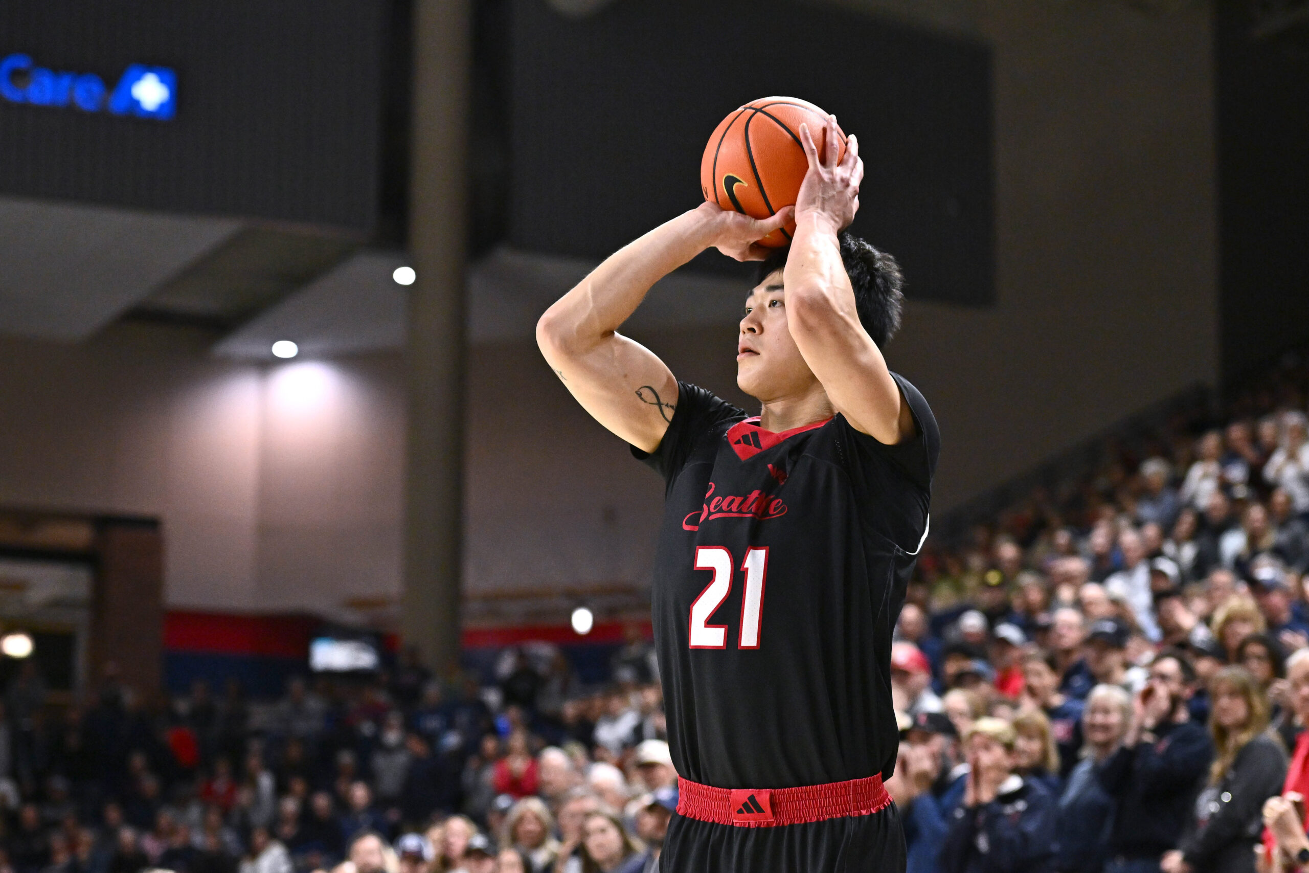 Jan 2, 2026; Spokane, Washington, USA; Seattle U Redhawks forward Junseok Yeo (21) shoots the ball against the Gonzaga Bulldogs in the second half at McCarthey Athletic Center. Mandatory Credit: James Snook-Imagn Images
