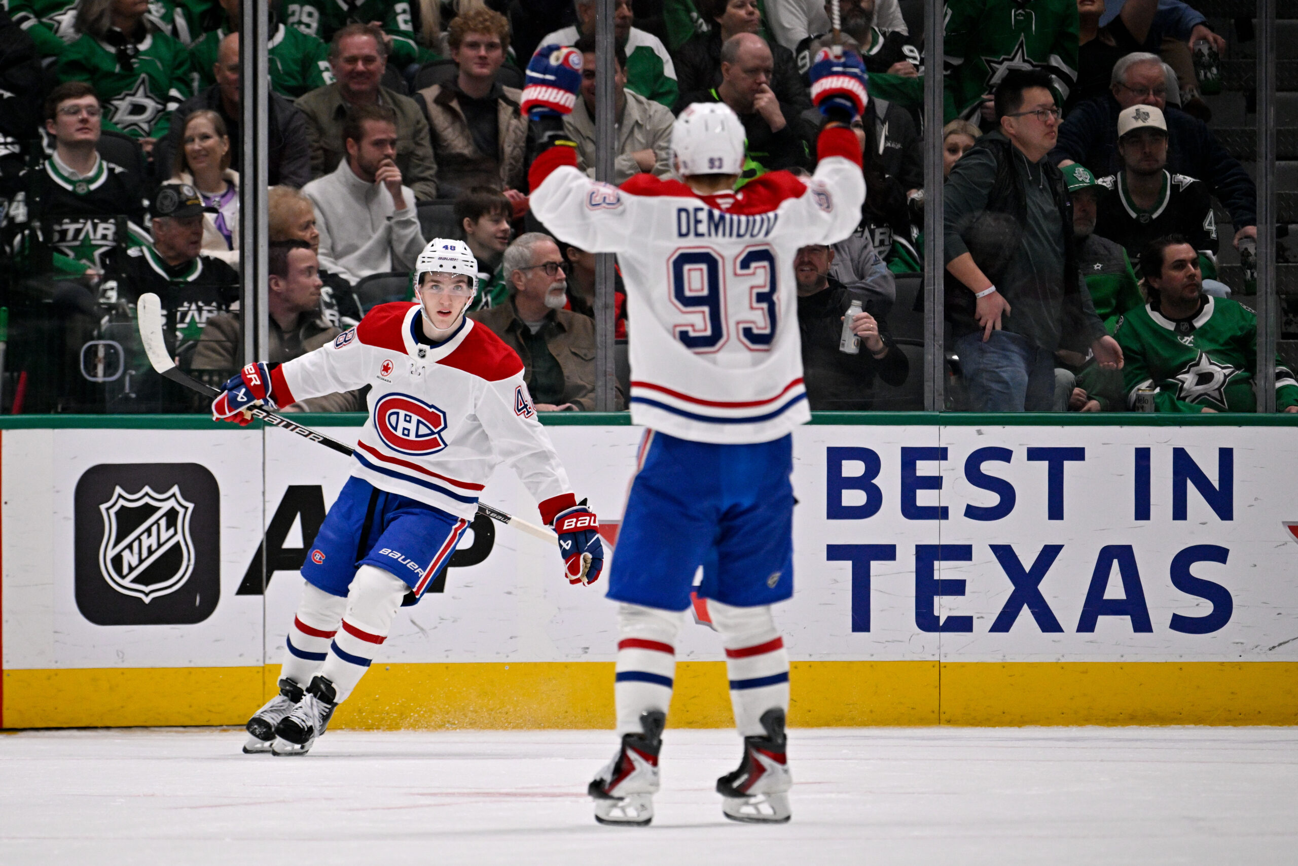 Jan 4, 2026; Dallas, Texas, USA; Montreal Canadiens defenseman Lane Hutson (48) and right wing Ivan Demidov (93) celebrates Hutson scoring the game winning goal against the Dallas Stars during the overtime period at the American Airlines Center. Mandatory Credit: Jerome Miron-Imagn Images