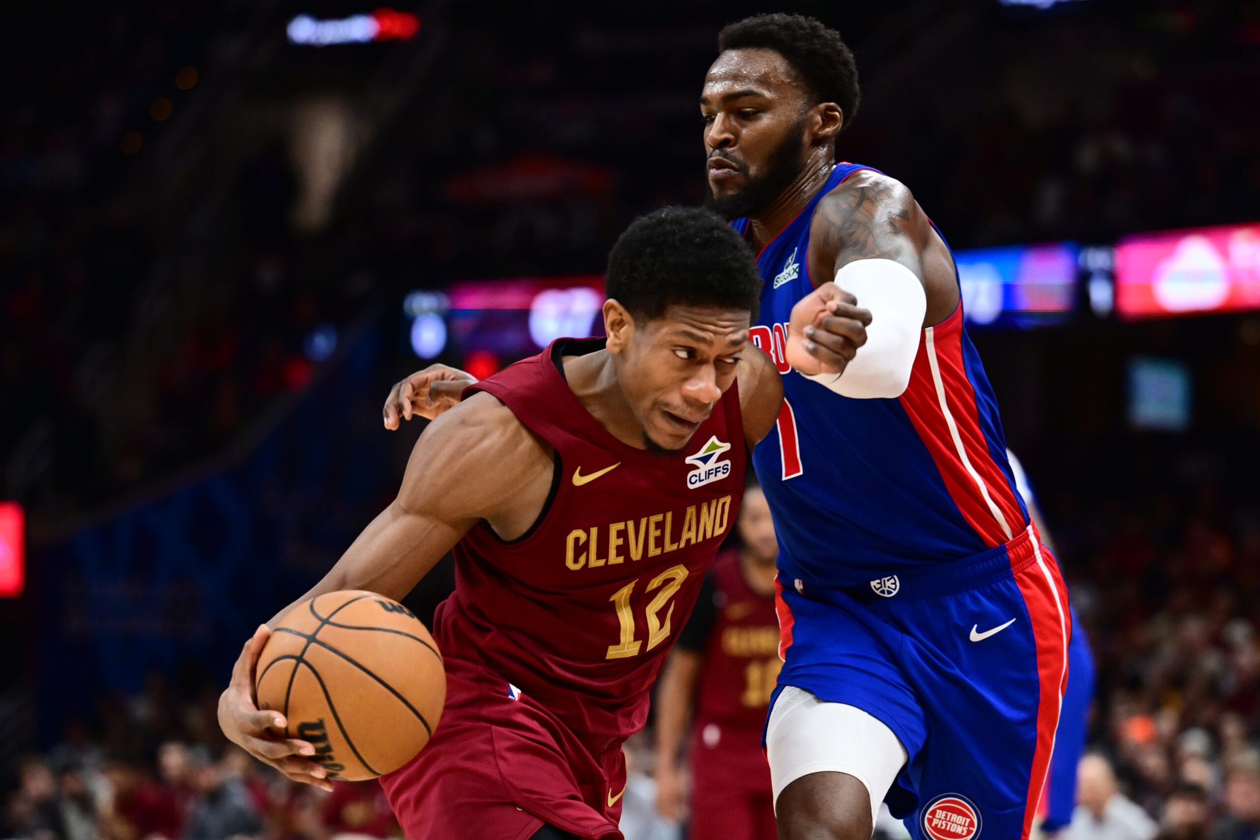 Jan 4, 2026; Cleveland, Ohio, USA; Cleveland Cavaliers forward De'andre Hunter (12) drives to the basket against Detroit Pistons forward Paul Reed (7) during the second half at Rocket Arena. Mandatory Credit: Ken Blaze-Imagn Images