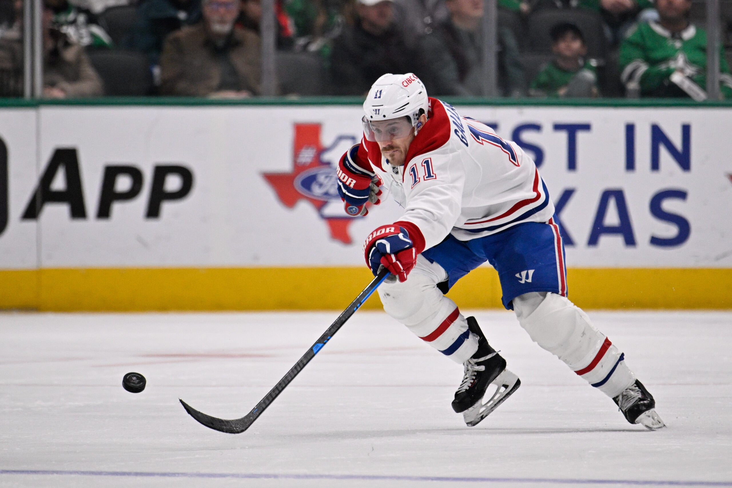 Jan 4, 2026; Dallas, Texas, USA; Montreal Canadiens right wing Brendan Gallagher (11) chases the puck during the third period against the Dallas Stars at the American Airlines Center. Mandatory Credit: Jerome Miron-Imagn Images
