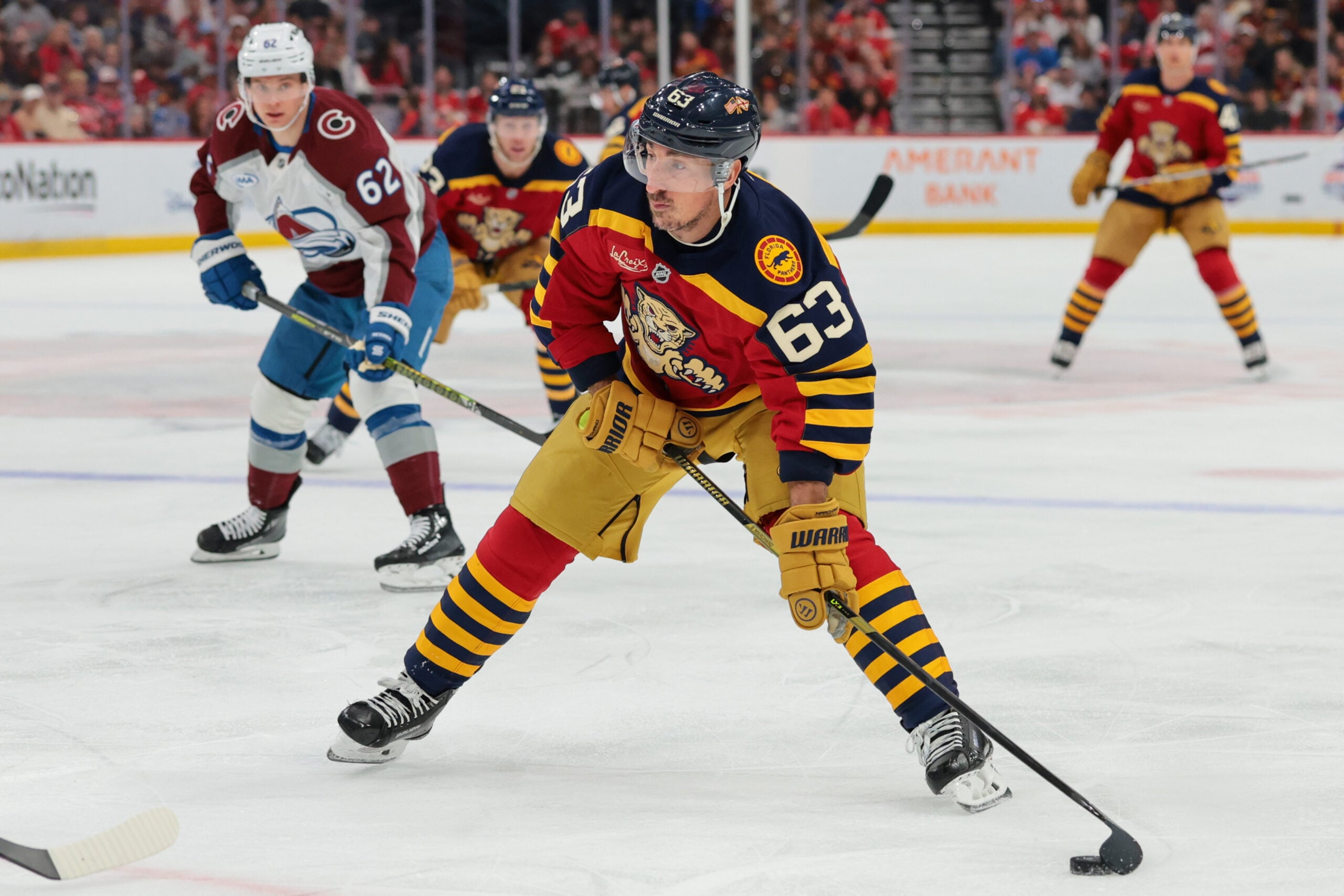 Jan 4, 2026; Sunrise, Florida, USA; Florida Panthers left wing Brad Marchand (63) moves the puck against the Colorado Avalanche during the first period at Amerant Bank Arena. Mandatory Credit: Sam Navarro-Imagn Images