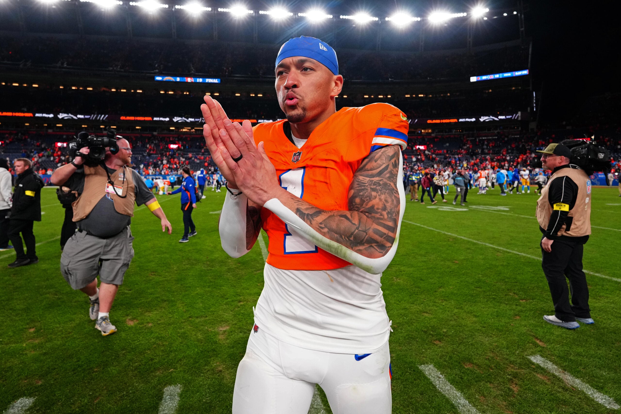 Jan 4, 2026; Denver, Colorado, USA; Denver Broncos tight end Evan Engram (1) looks on after winning the game against the Los Angeles Chargers at Empower Field at Mile High. Mandatory Credit: Ron Chenoy-Imagn Images