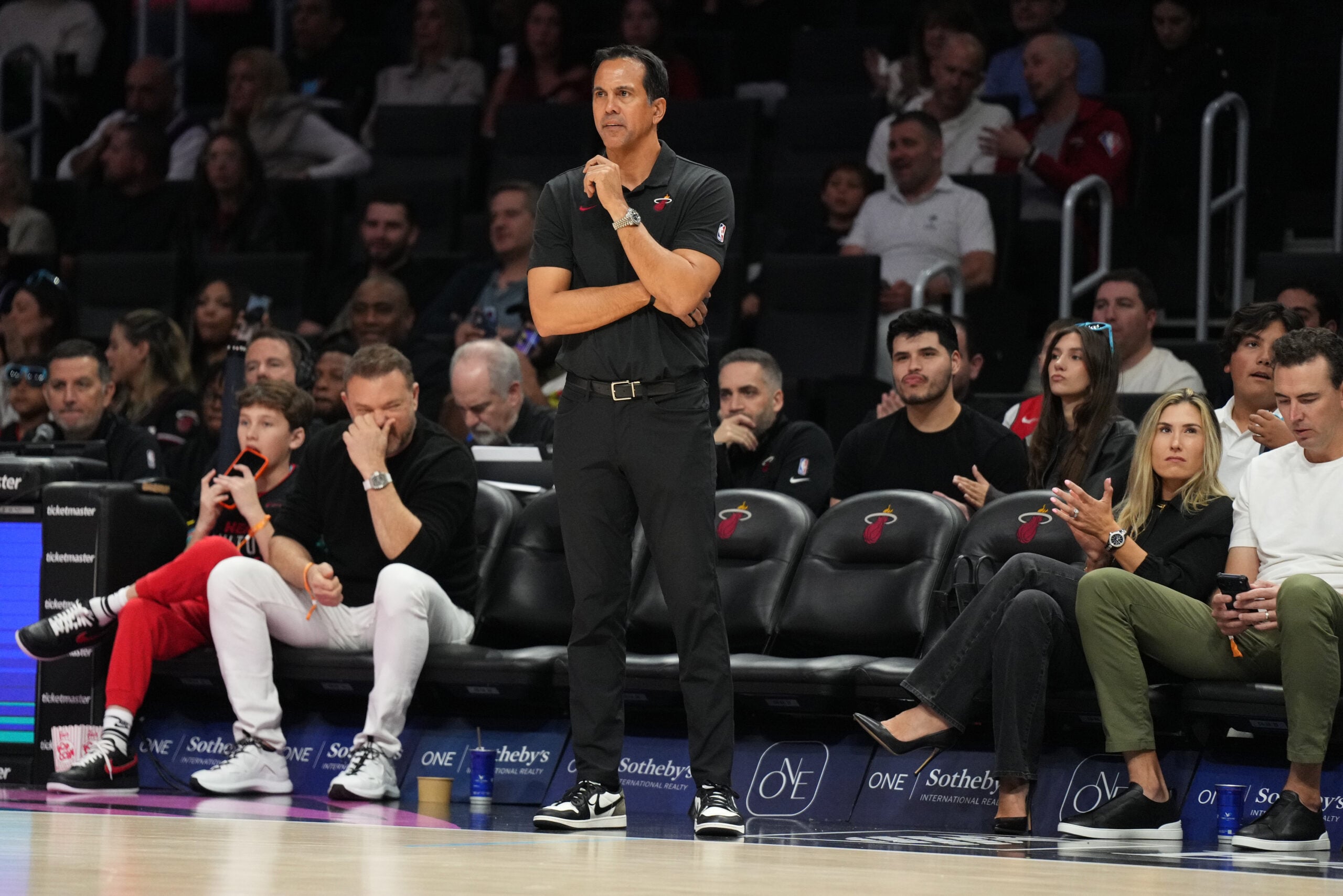 Jan 4, 2026; Miami, Florida, USA;  Miami Heat head coach Erik Spoelstra keeps his eyes on his team during the first half at Kaseya Center against the New Orleans Pelicans. Mandatory Credit: Jim Rassol-Imagn Images