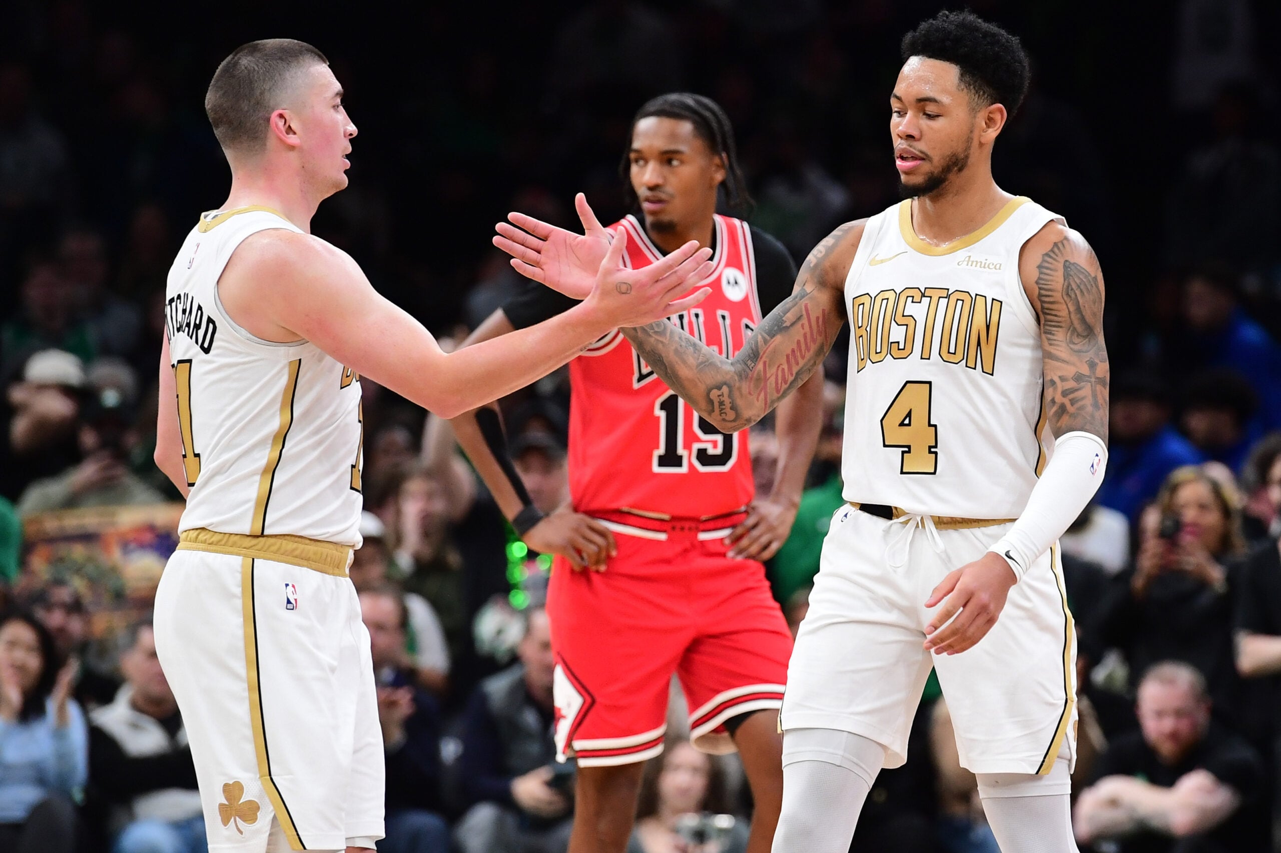 Jan 5, 2026; Boston, Massachusetts, USA; Boston Celtics guard Payton Pritchard (11) congratulates guard Anfernee Simons (4) after a basket during the second half against the Chicago Bulls at TD Garden. Mandatory Credit: Bob DeChiara-Imagn Images