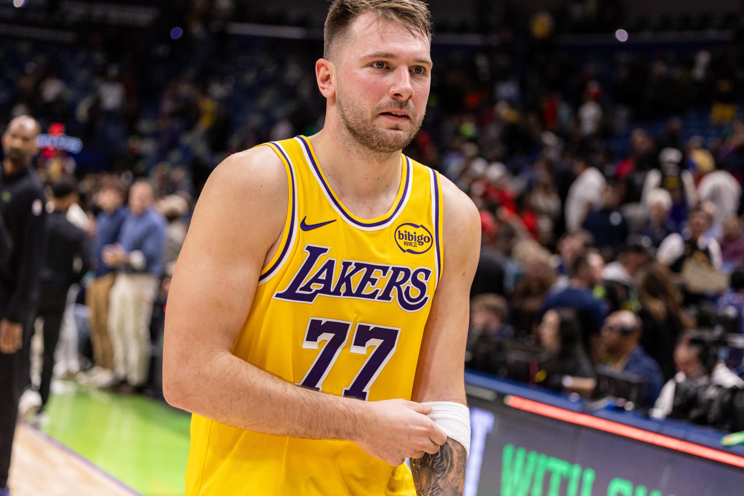 Jan 6, 2026; New Orleans, Louisiana, USA;  Los Angeles Lakers forward/guard Luka Doncic (77)  heads to the locker room after the game against the New Orleans Pelicans at Smoothie King Center. Mandatory Credit: Stephen Lew-Imagn Images