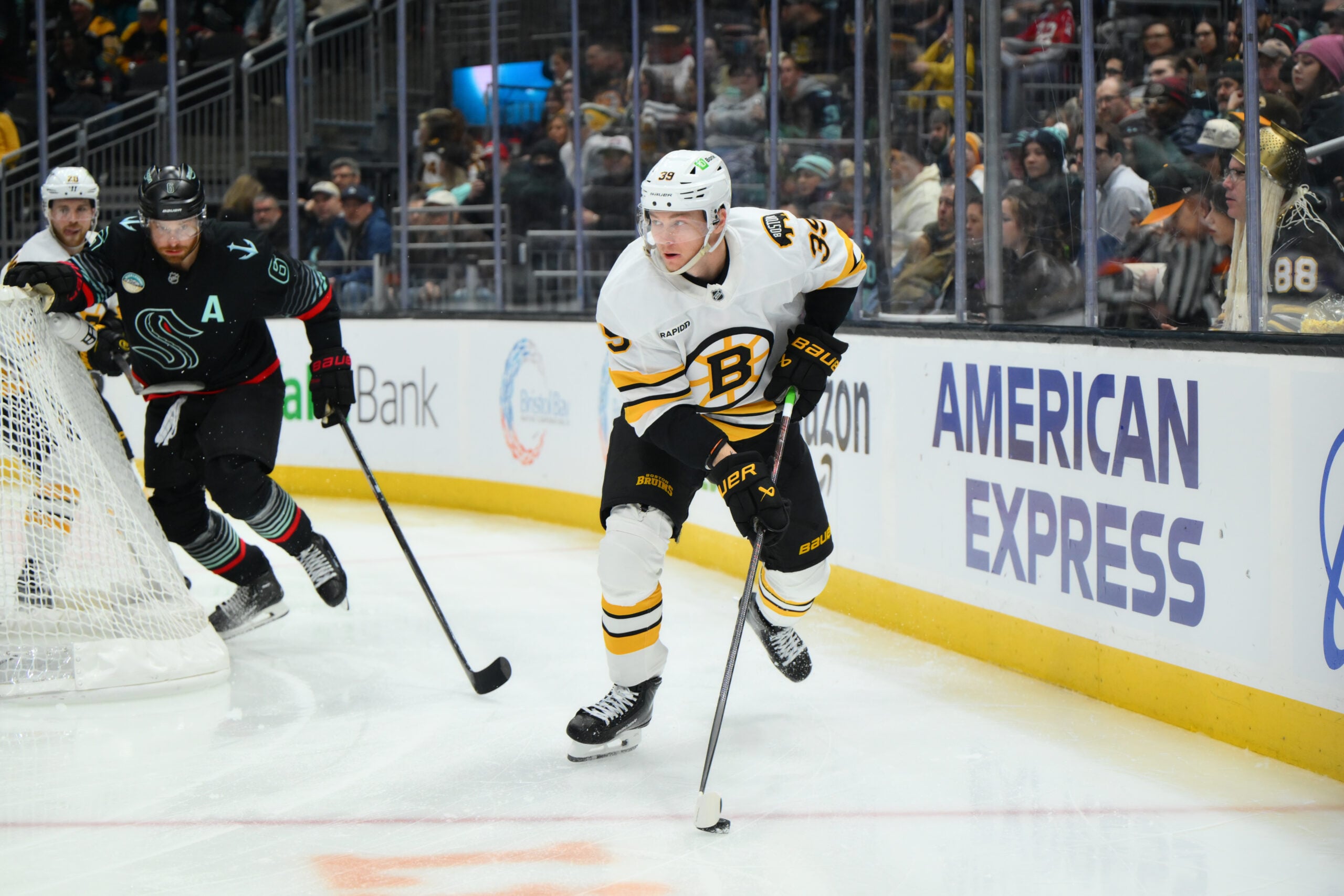 Jan 6, 2026; Seattle, Washington, USA; Boston Bruins center Morgan Geekie (39) plays the puck during the third period against the Seattle Kraken at Climate Pledge Arena. Mandatory Credit: Steven Bisig-Imagn Images