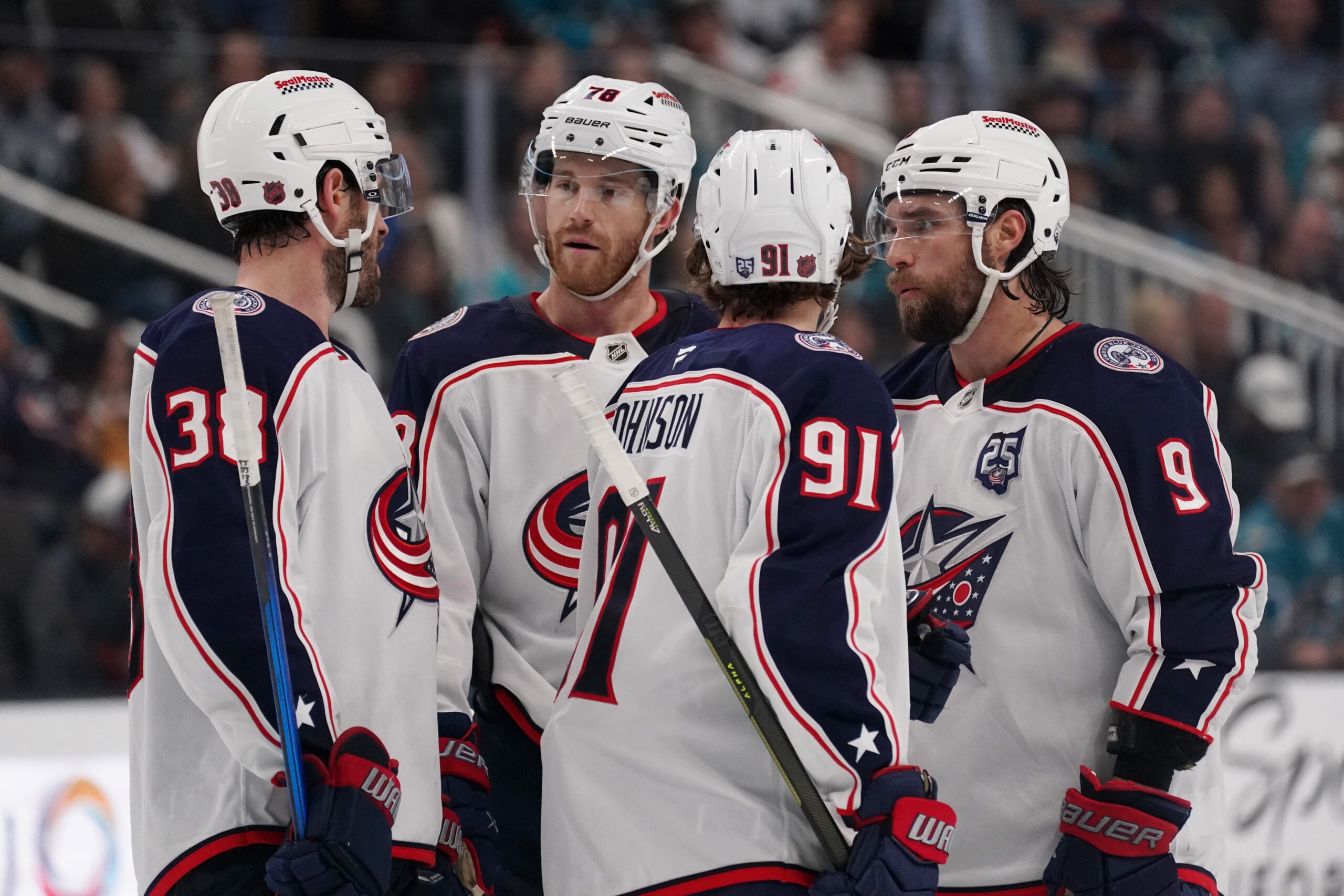 Jan 6, 2026; San Jose, California, USA;  Columbus Blue Jackets center Boone Jenner (38), defenseman Damon Severson (78), center Kent Johnson (91), and defenseman Ivan Provorov (9) talk during a break in the action against the San Jose Sharks in the third period at SAP Center at San Jose. Mandatory Credit: David Gonzales-Imagn Images