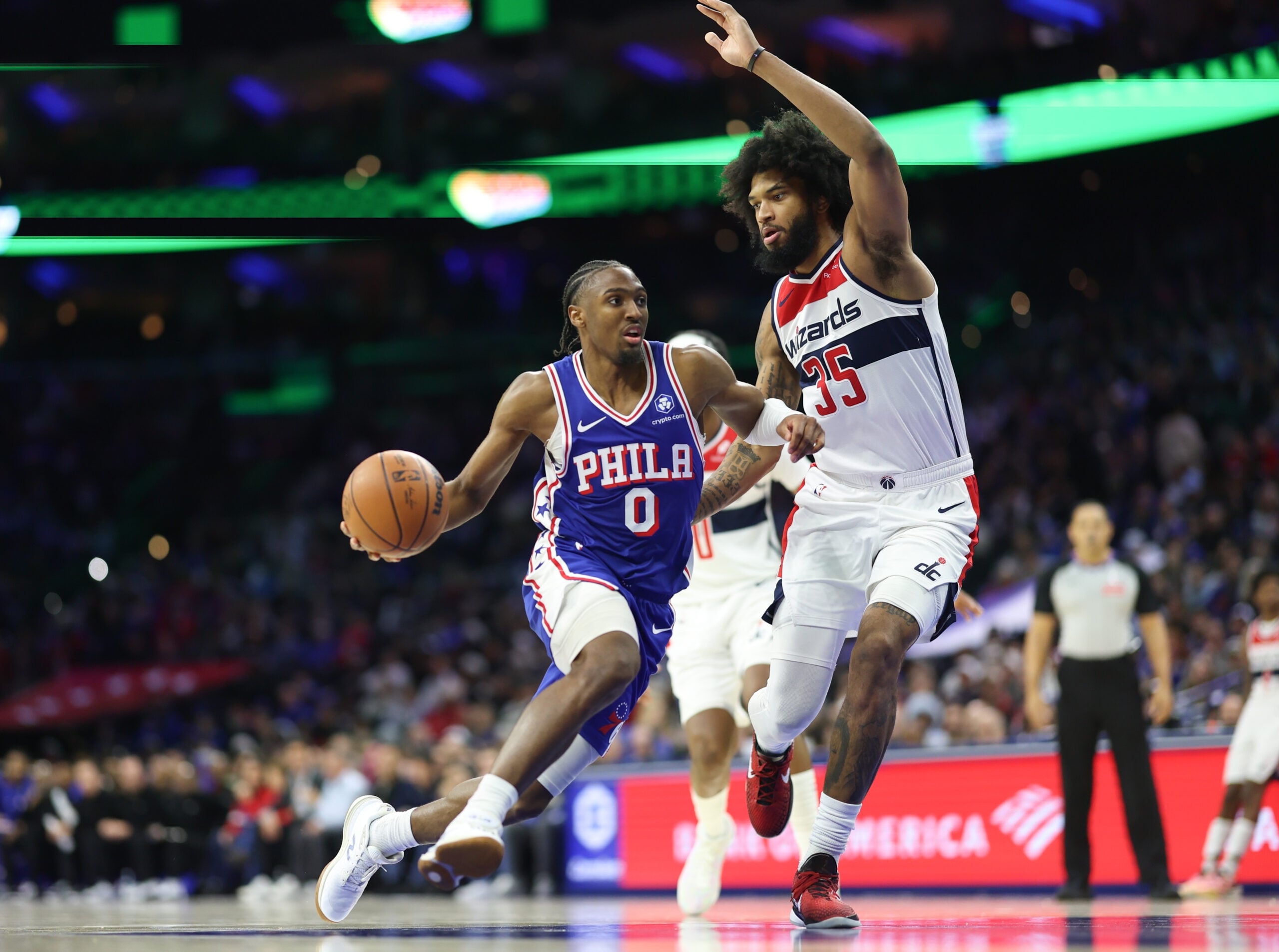 Jan 7, 2026; Philadelphia, Pennsylvania, USA; Philadelphia 76ers guard Tyrese Maxey (0) dribbles the ball against Washington Wizards forward Marvin Bagley III (35) during the third quarter at Xfinity Mobile Arena. Mandatory Credit: Bill Streicher-Imagn Images