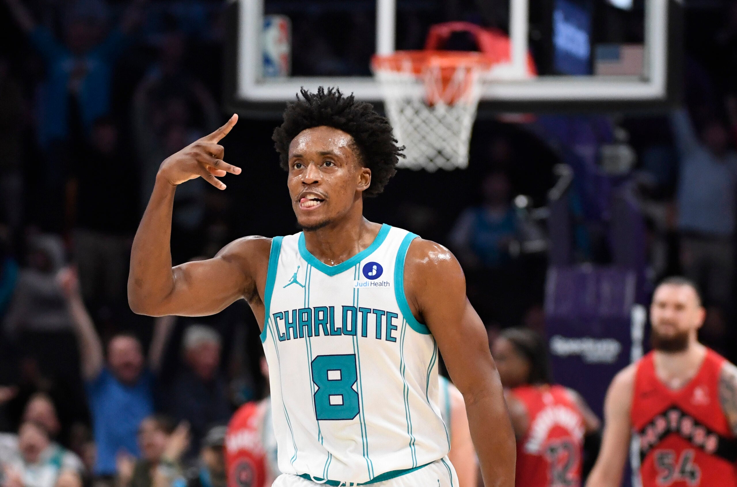 Jan 7, 2026; Charlotte, North Carolina, USA; Charlotte Hornets guard Collin Sexton (8) reacts after scoring during the second half against the Toronto Raptors at the Spectrum Center. Mandatory Credit: Sam Sharpe-Imagn Images