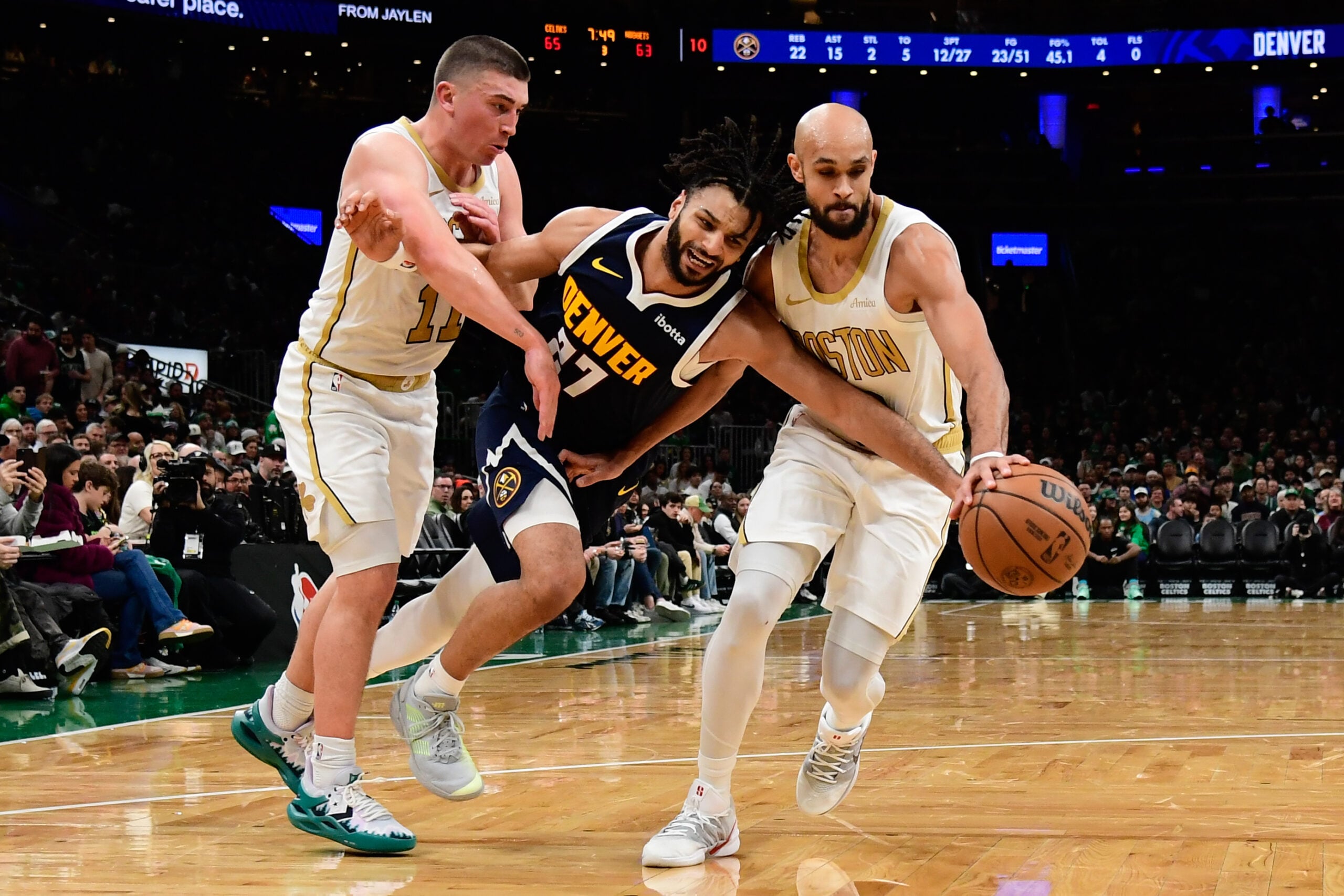 Jan 7, 2026; Boston, Massachusetts, USA; Boston Celtics guard Payton Pritchard (11) fouls Denver Nuggets guard Jamal Murray (27) during the second half at TD Garden. Mandatory Credit: Bob DeChiara-Imagn Images