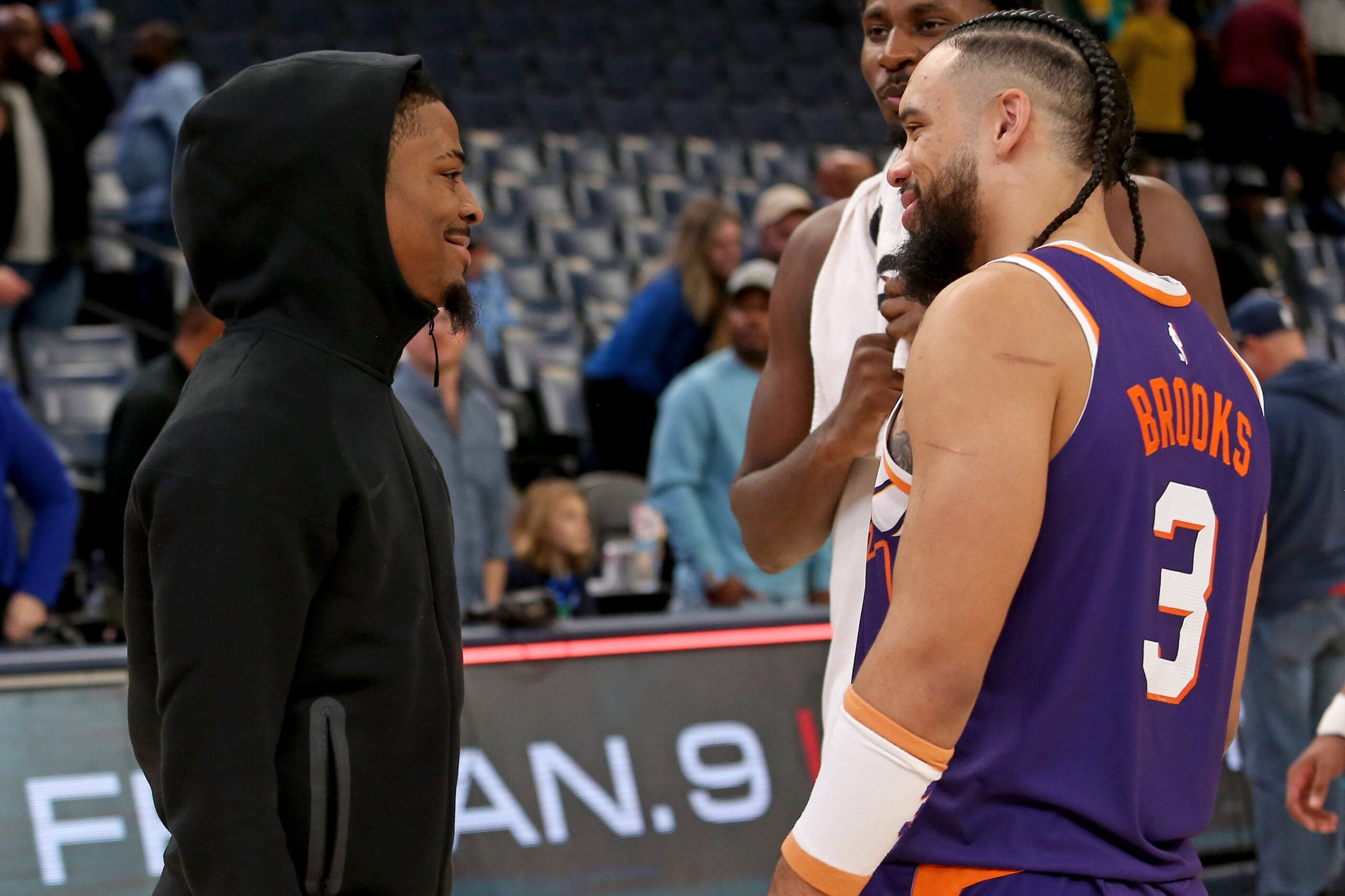 Jan 7, 2026; Memphis, Tennessee, USA; Memphis Grizzlies guard Ja Morant (left) talks with Phoenix Suns forward Dillon Brooks (3) after the game at FedExForum. Mandatory Credit: Petre Thomas-Imagn Images
