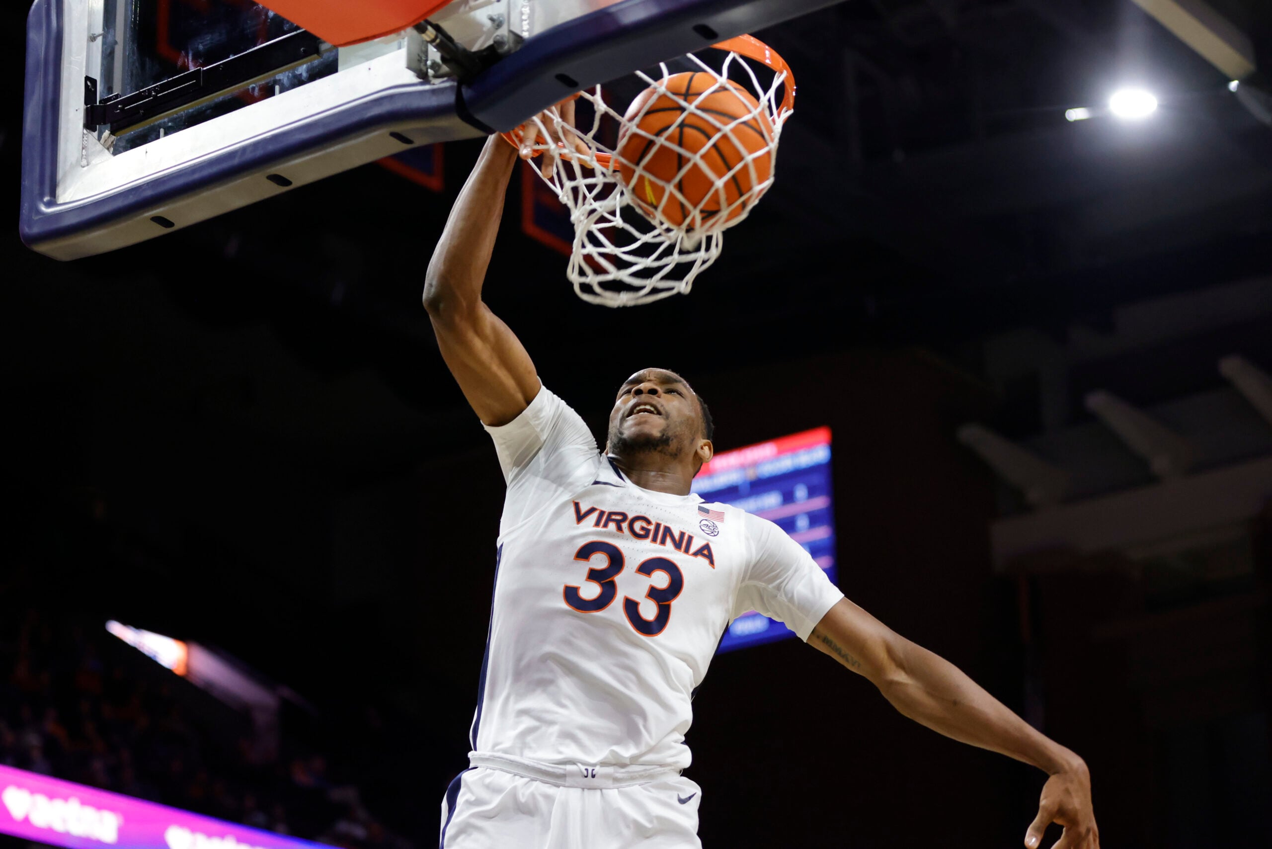 Jan 7, 2026; Charlottesville, Virginia, USA; Virginia Cavaliers center Ugonna Onyenso (33) dunks the ball against the California Golden Bears during the second half at John Paul Jones Arena. Mandatory Credit: Amber Searls-Imagn Images