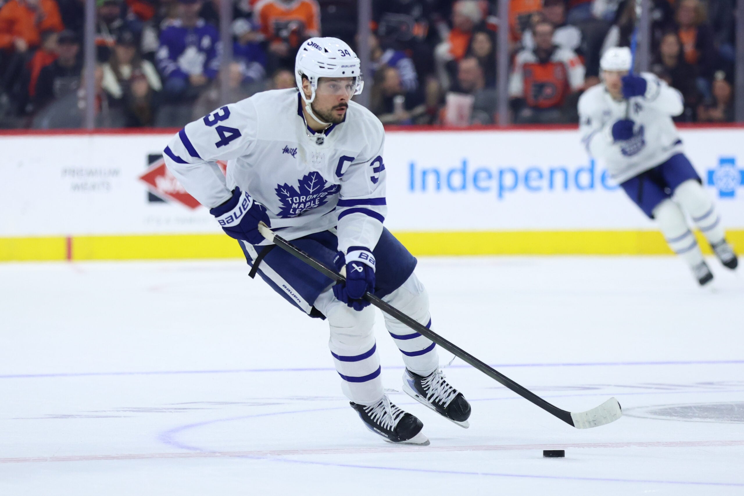 Jan 8, 2026; Philadelphia, Pennsylvania, USA; Toronto Maple Leafs center Auston Matthews (34) skates with the puck against the Philadelphia Flyers during overtime at Xfinity Mobile Arena. Mandatory Credit: Bill Streicher-Imagn Images