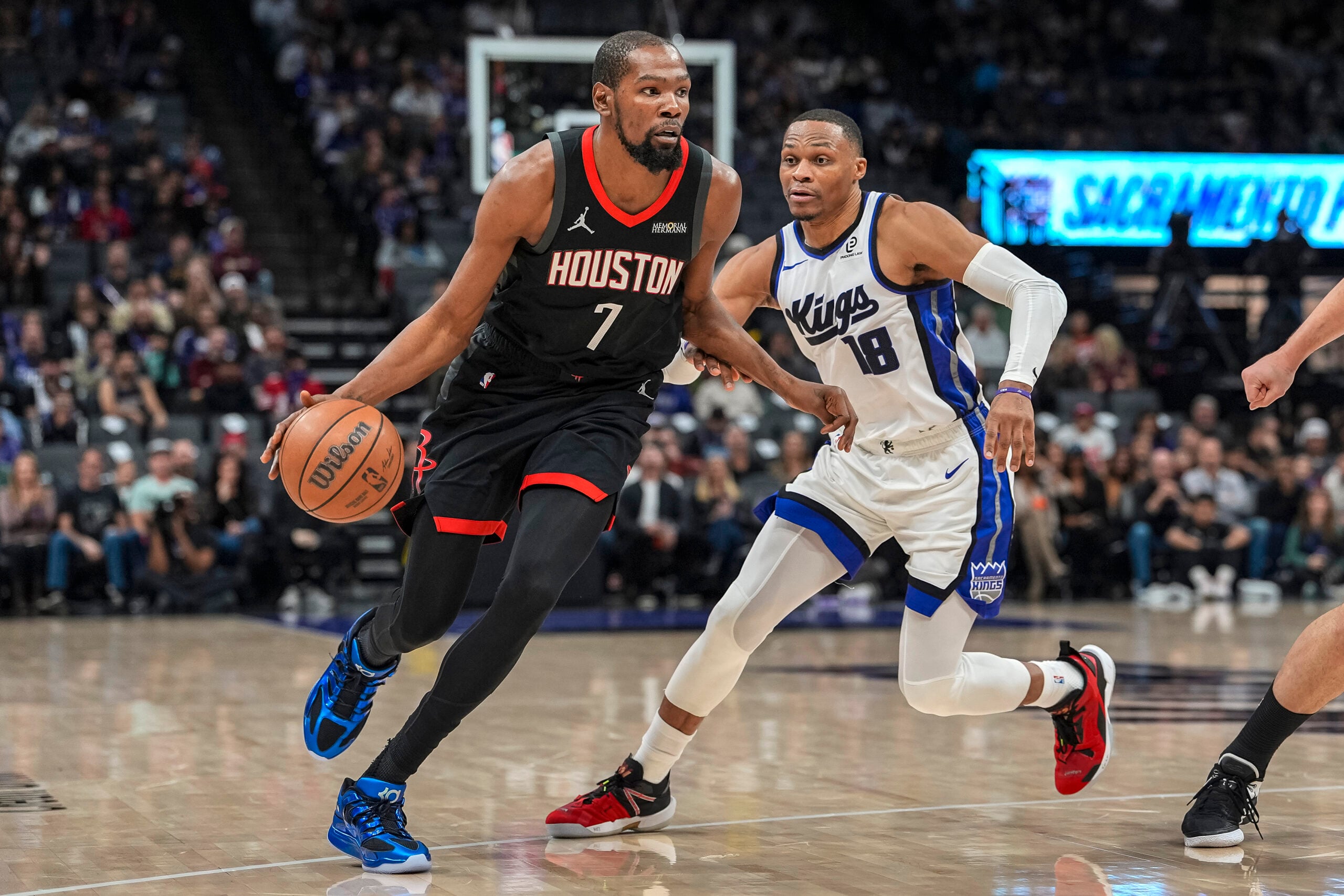 Jan 11, 2026; Sacramento, California, USA; Houston Rockets forward Kevin Durant (7) dribbles against Sacramento Kings guard Russell Westbrook (18) during the fourth quarter at Golden 1 Center. Mandatory Credit: Justine Willard-Imagn Images