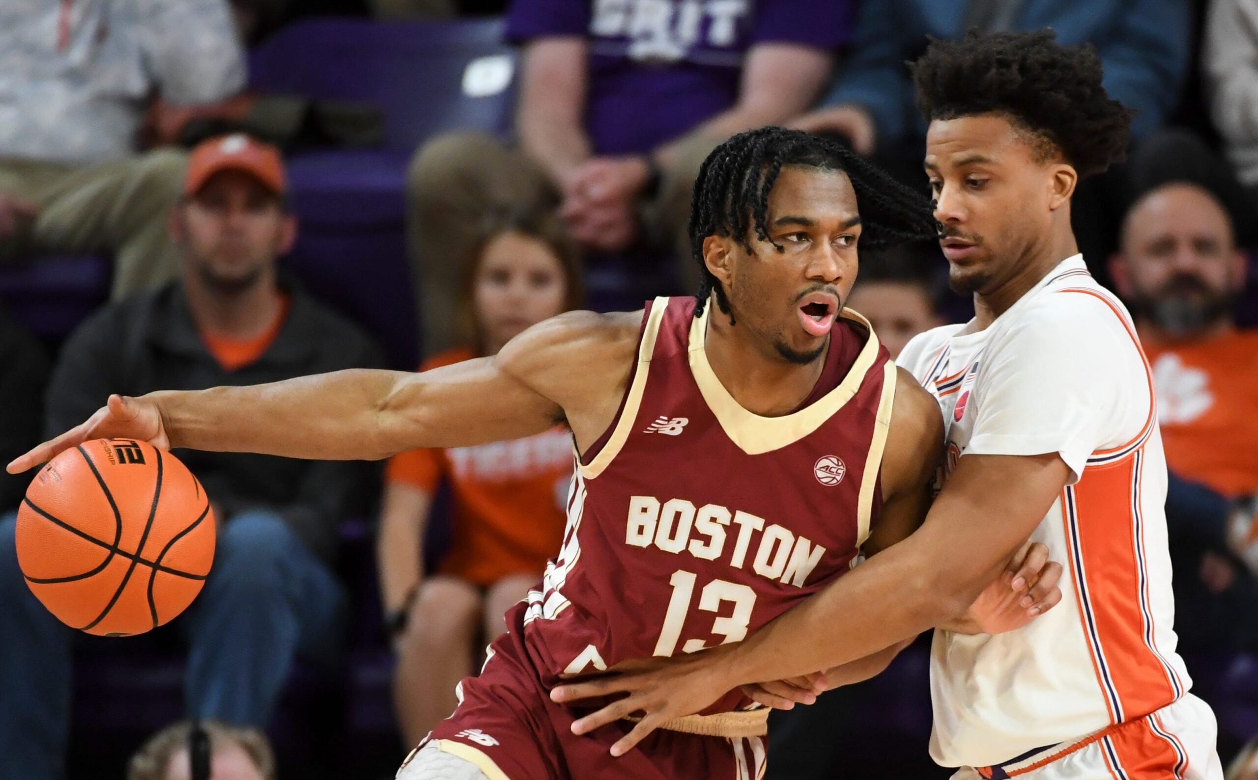 Boston College Eagles guard Donald Hand Jr. (13) is defended by Clemson Tigers guard Efrem Johnson (4) Tuesday, Jan. 13, 2026, during the NCAA men’s basketball game at Littlejohn Coliseum in Clemson, South Carolina.