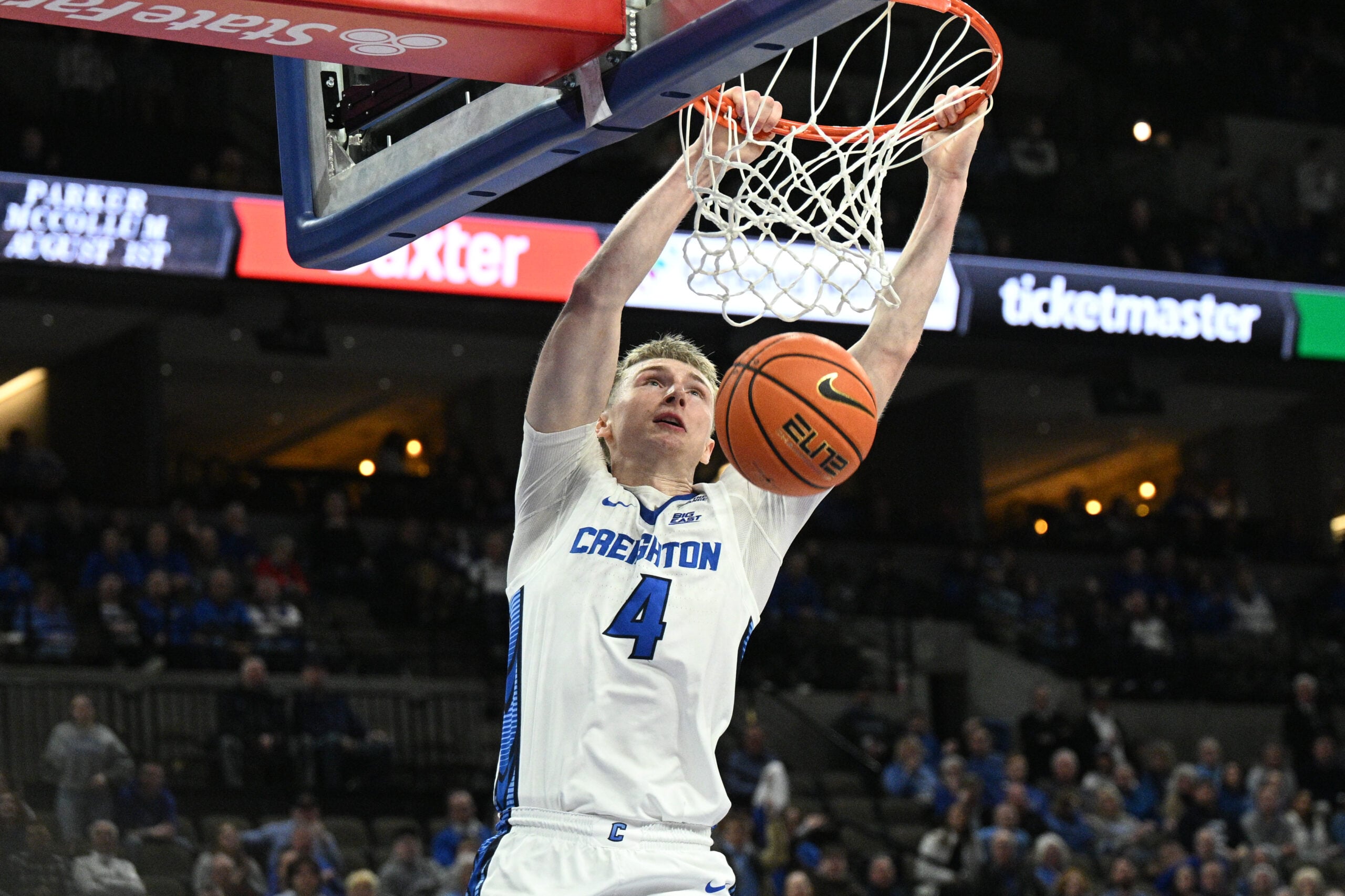 Jan 13, 2026; Omaha, Nebraska, USA;  Creighton Bluejays guard Josh Dix (4) dunks against the Georgetown Hoyas during the second half at CHI Health Center Omaha. Mandatory Credit: Steven Branscombe-Imagn Images