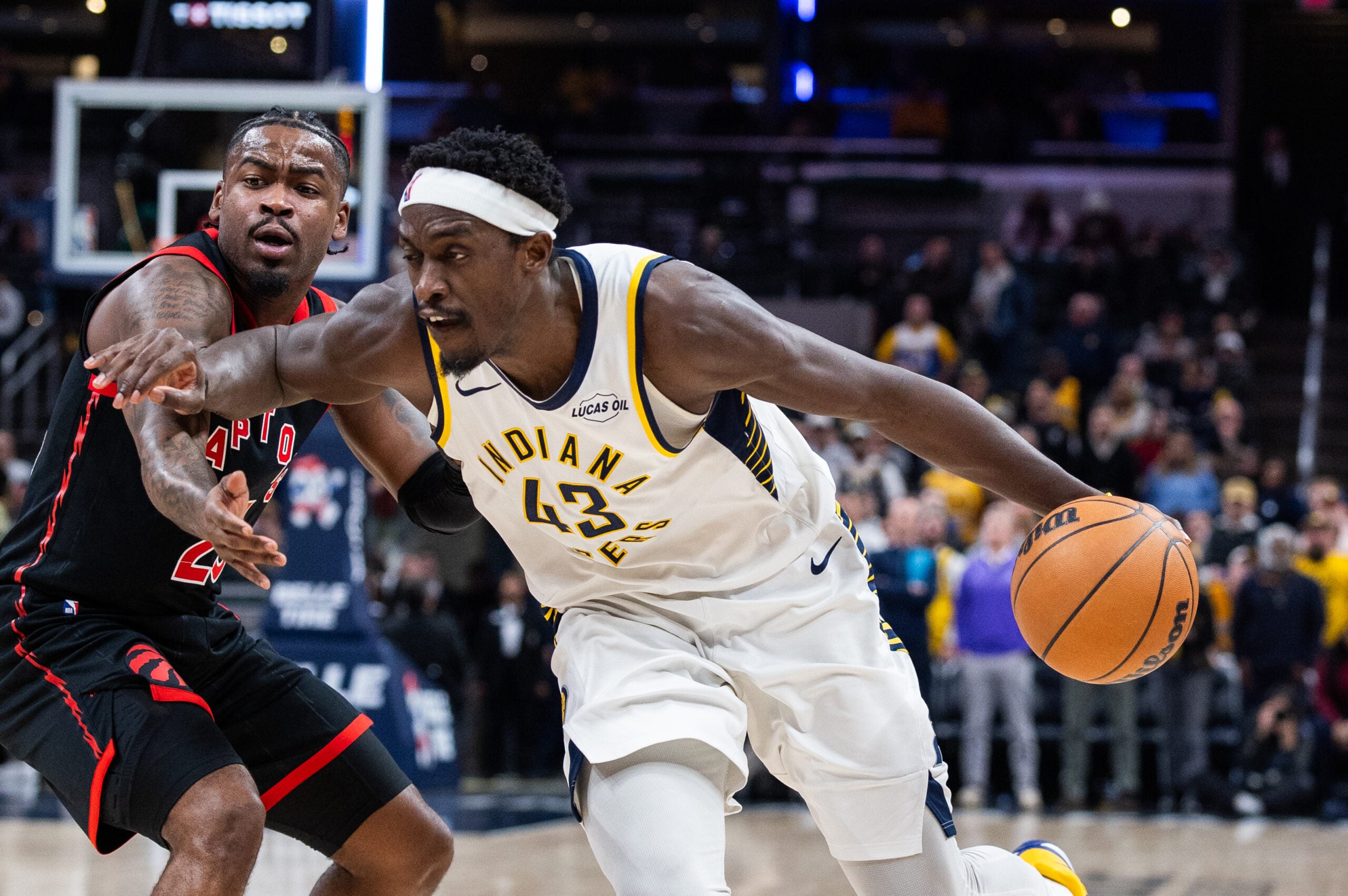 Jan 14, 2026; Indianapolis, Indiana, USA; Indiana Pacers forward Pascal Siakam (43) dribbles the ball while Toronto Raptors guard Jamal Shead (23) defends in the second half at Gainbridge Fieldhouse. Mandatory Credit: Trevor Ruszkowski-Imagn Images