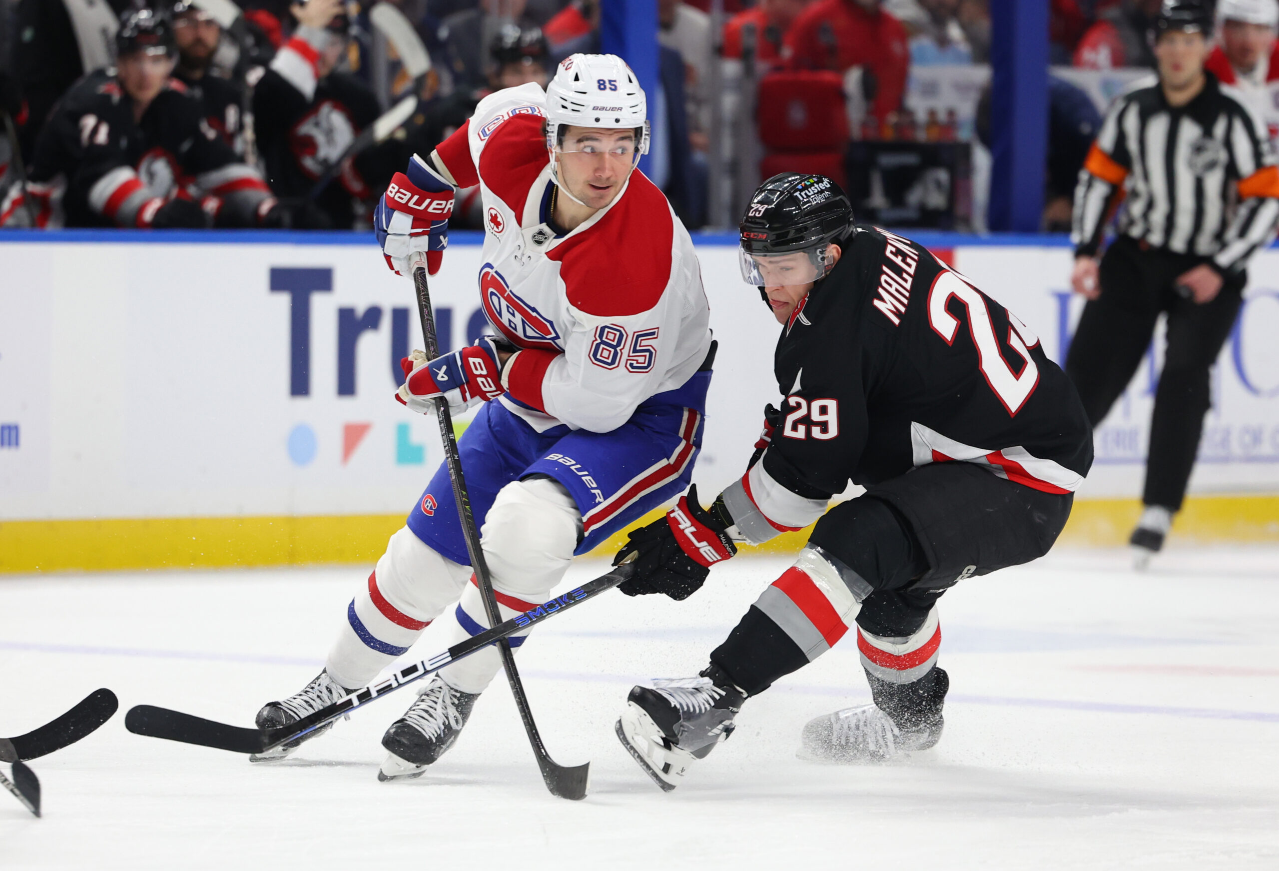 Jan 15, 2026; Buffalo, New York, USA;  Montréal Canadiens left wing Alexandre Texier (85) makes a pass as Buffalo Sabres left wing Beck Malenstyn (29) defends during the first period at KeyBank Center. Mandatory Credit: Timothy T. Ludwig-Imagn Images