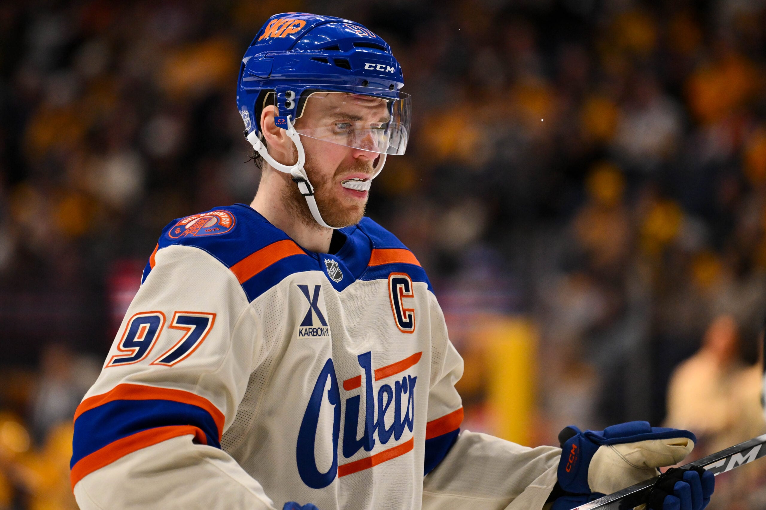 Jan 13, 2026; Nashville, Tennessee, USA;  Edmonton Oilers center Connor McDavid (97) awaits the face off against the Nashville Predators during the second period at Bridgestone Arena. Mandatory Credit: Steve Roberts-Imagn Images