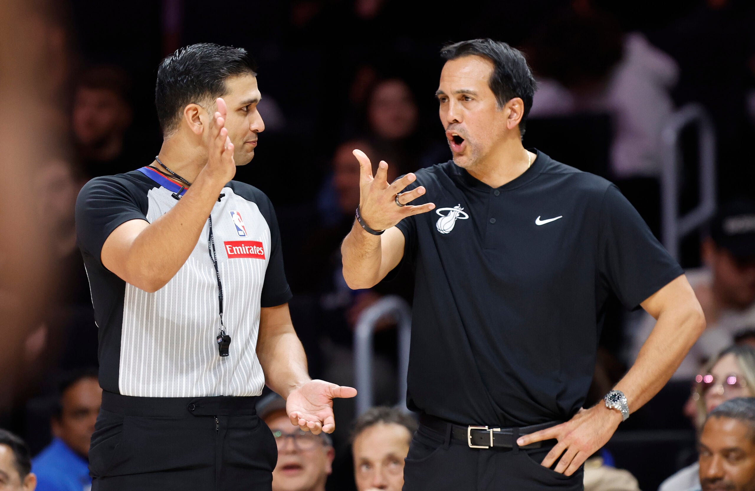 Jan 15, 2026; Miami, Florida, USA; Miami Heat head coach Erik Spoelstra speaks with referee Suyash Mehta (82) against the Boston Celtics during the second half at Kaseya Center. Mandatory Credit: Rhona Wise-Imagn Images