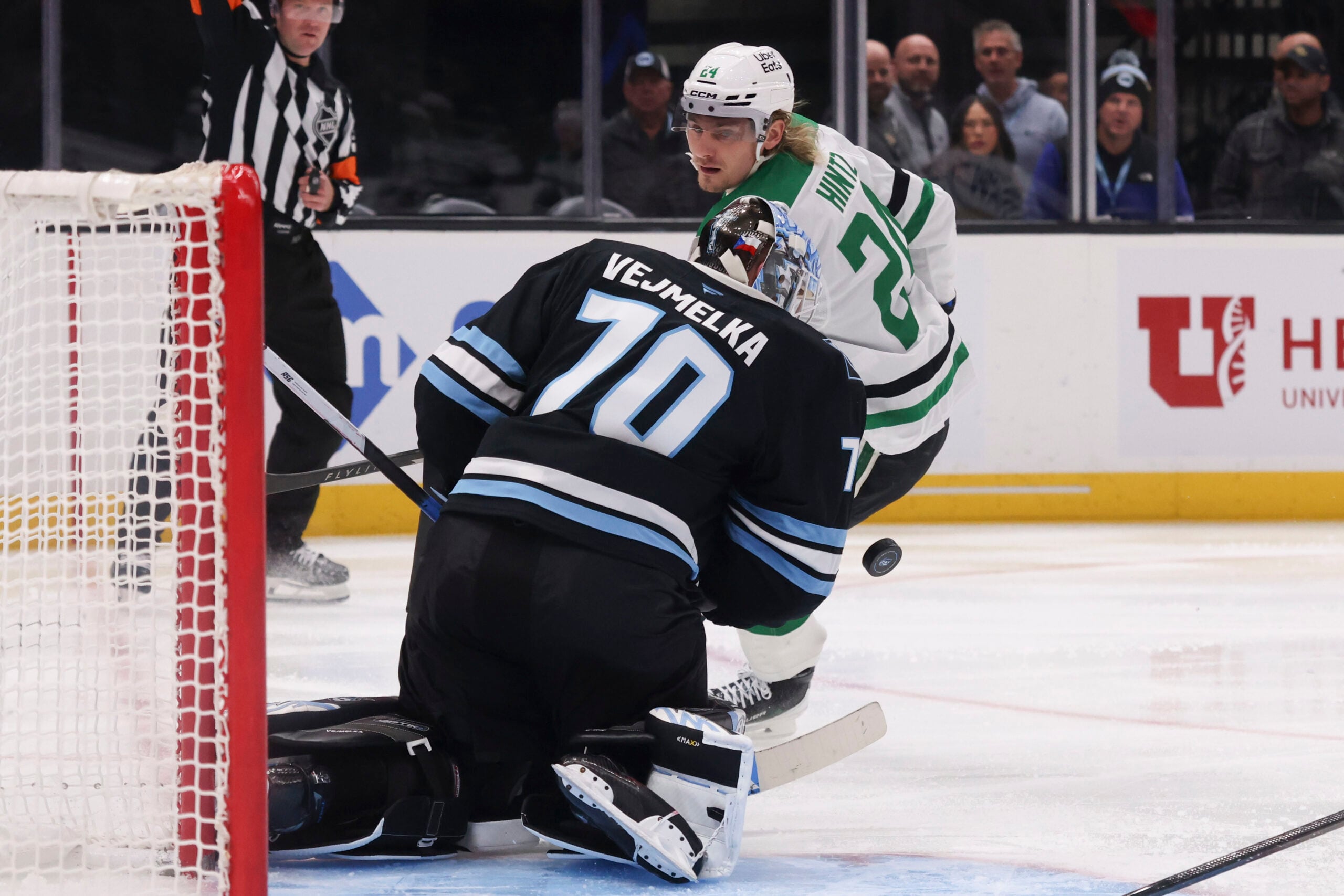 Jan 15, 2026; Salt Lake City, Utah, USA; Utah Mammoth goaltender Karel Vejmelka (70) blocks a shot by Dallas Stars center Roope Hintz (24) during the third period at Delta Center. Mandatory Credit: Rob Gray-Imagn Images
